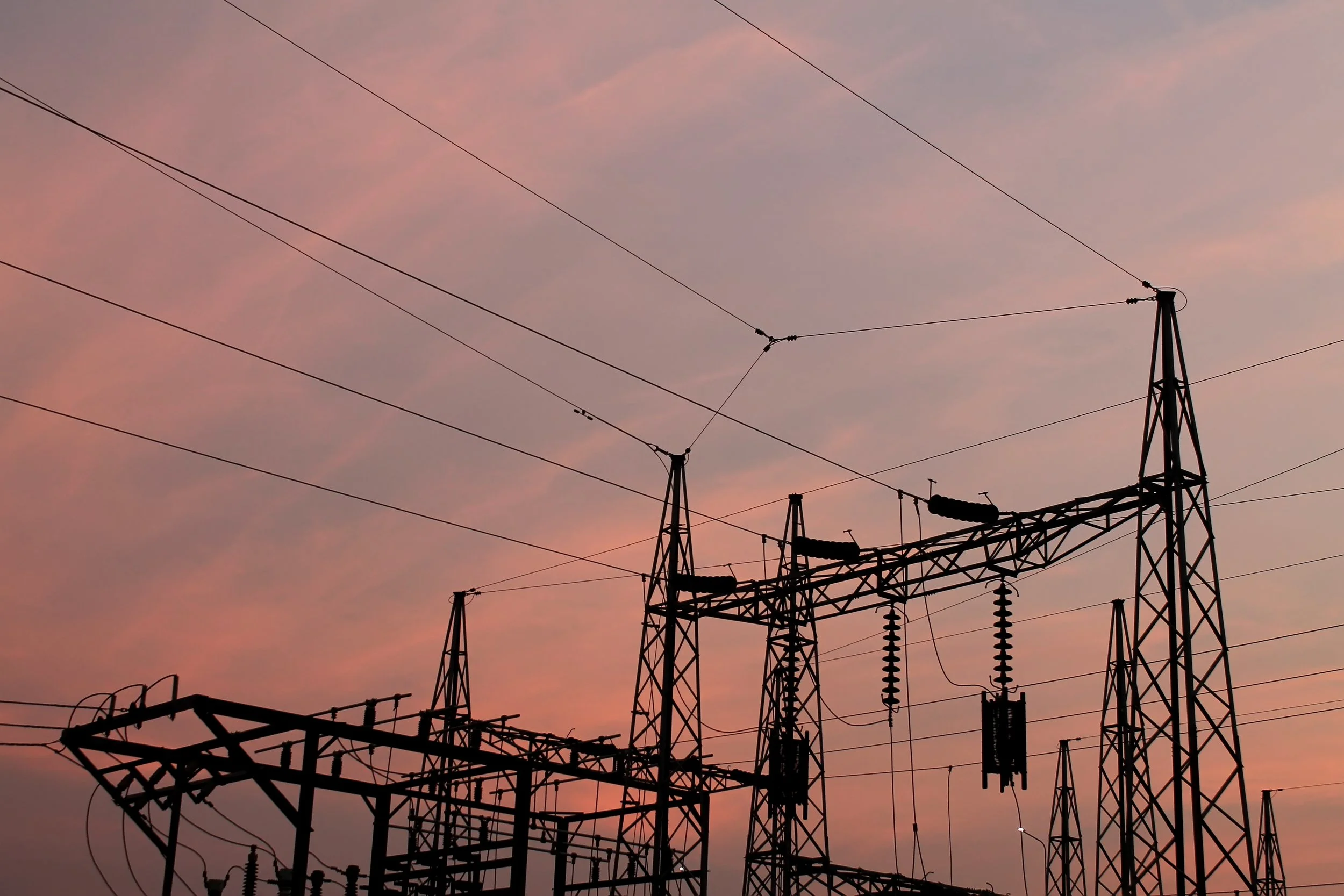 Electricity pylons with a moody sky in the background