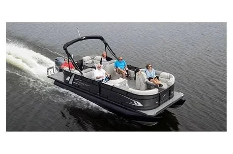 A group of five people enjoying a ride on a pontoon boat on water with a floating sunshade and an advertisement for a weekly special price of $2850 in a starburst shape.