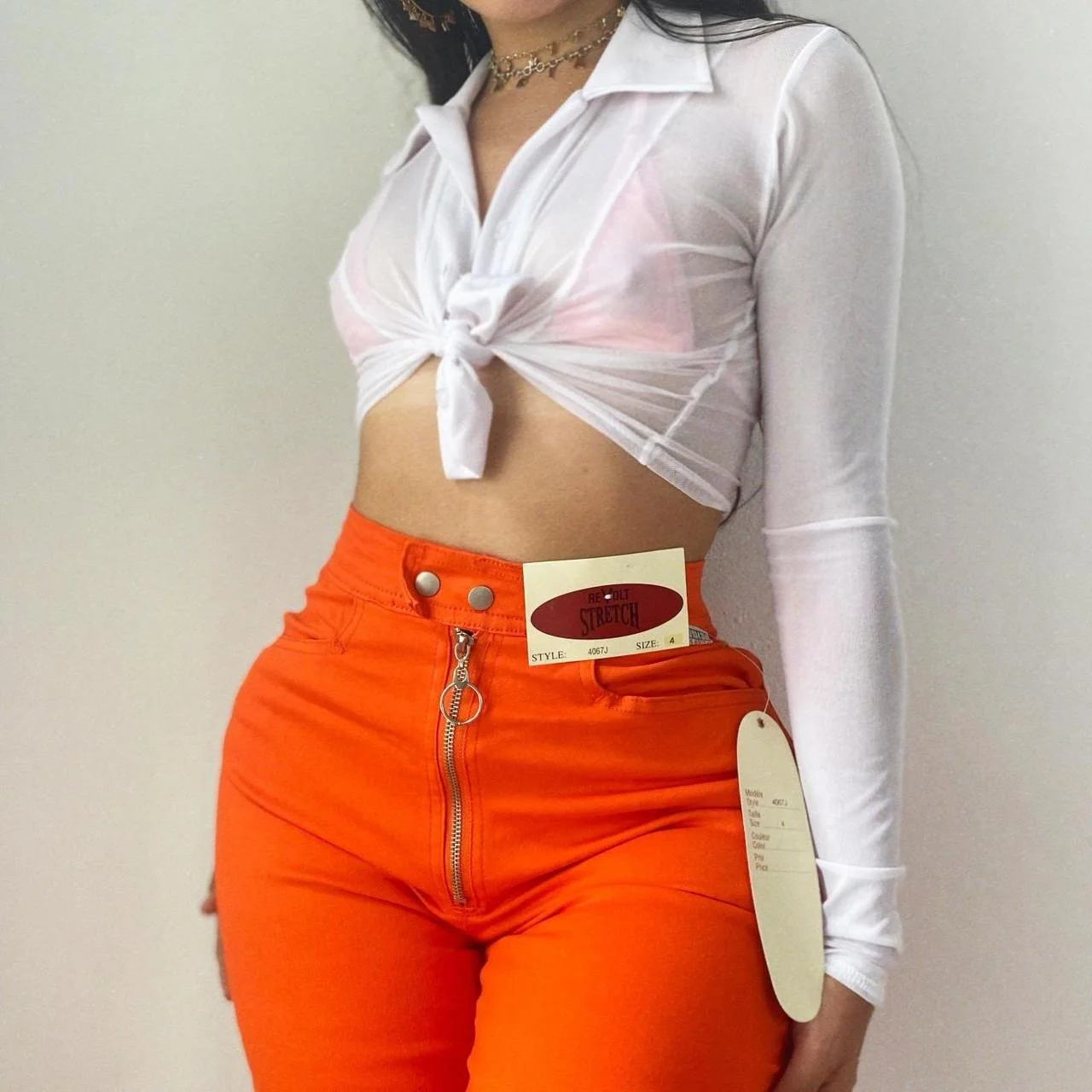 high waisted stretchy orange skinny pants by Revolt