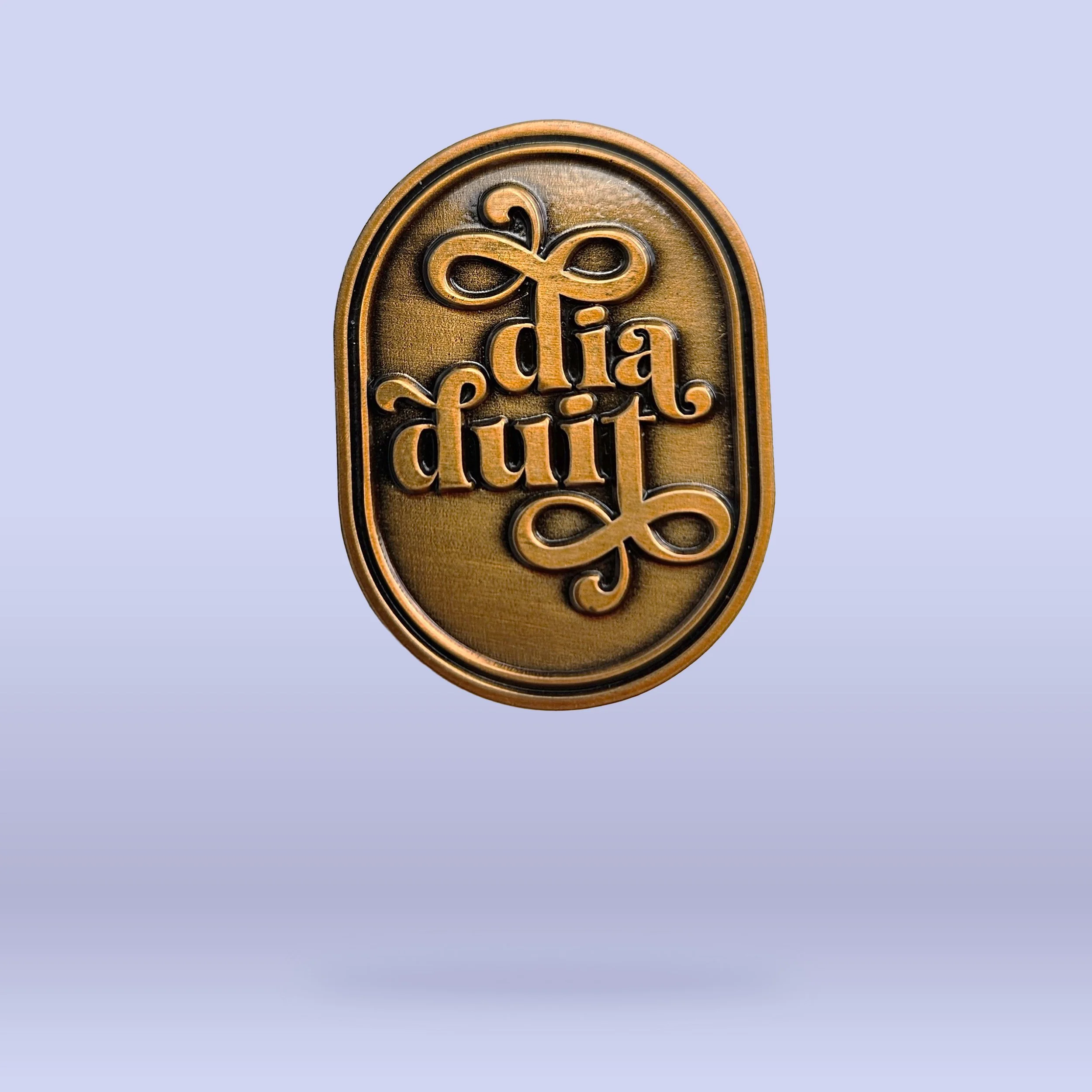The Gold 'Dia Duit' pin