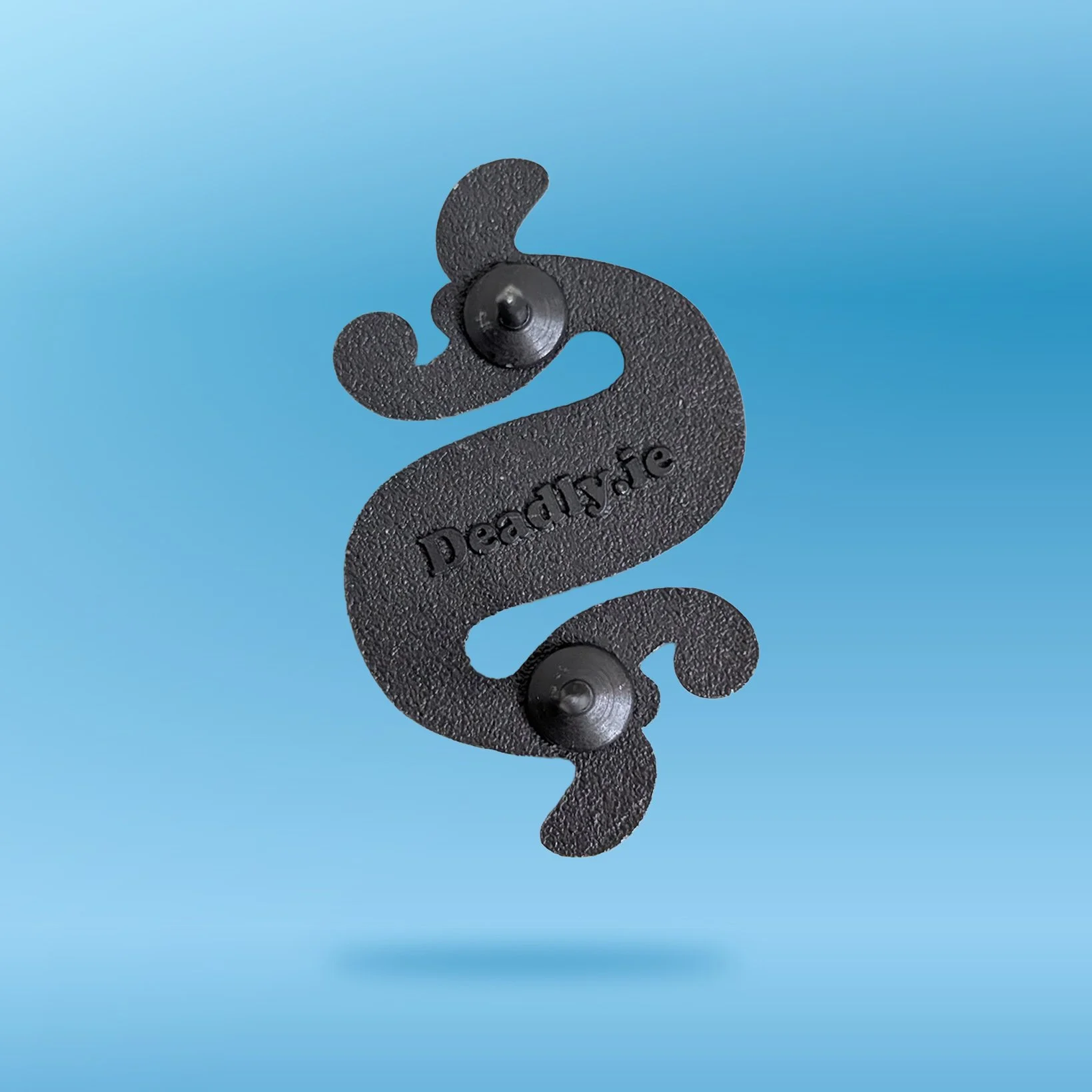 The back of the Dragonesque Brooch with two pin backs