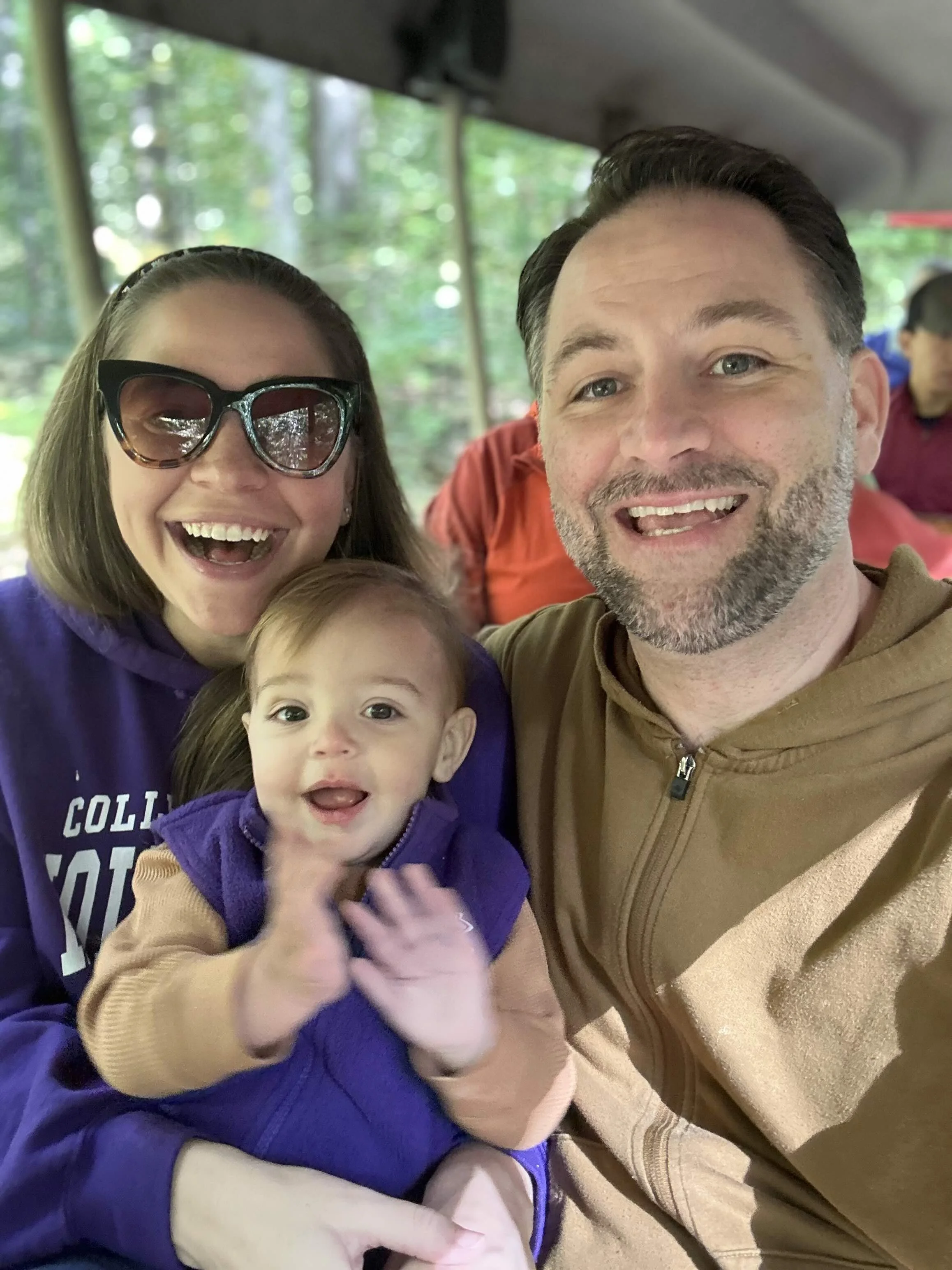 Happy family with a couple and their baby boy smiling in Alexandria, Virginia