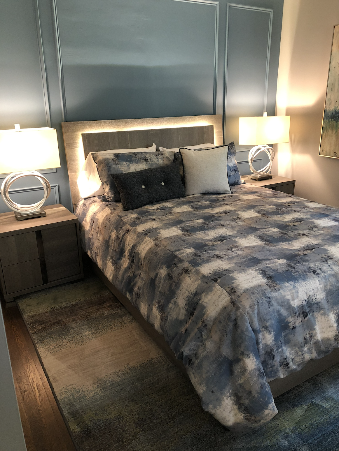 Guest bedroom bed with blue accent wall