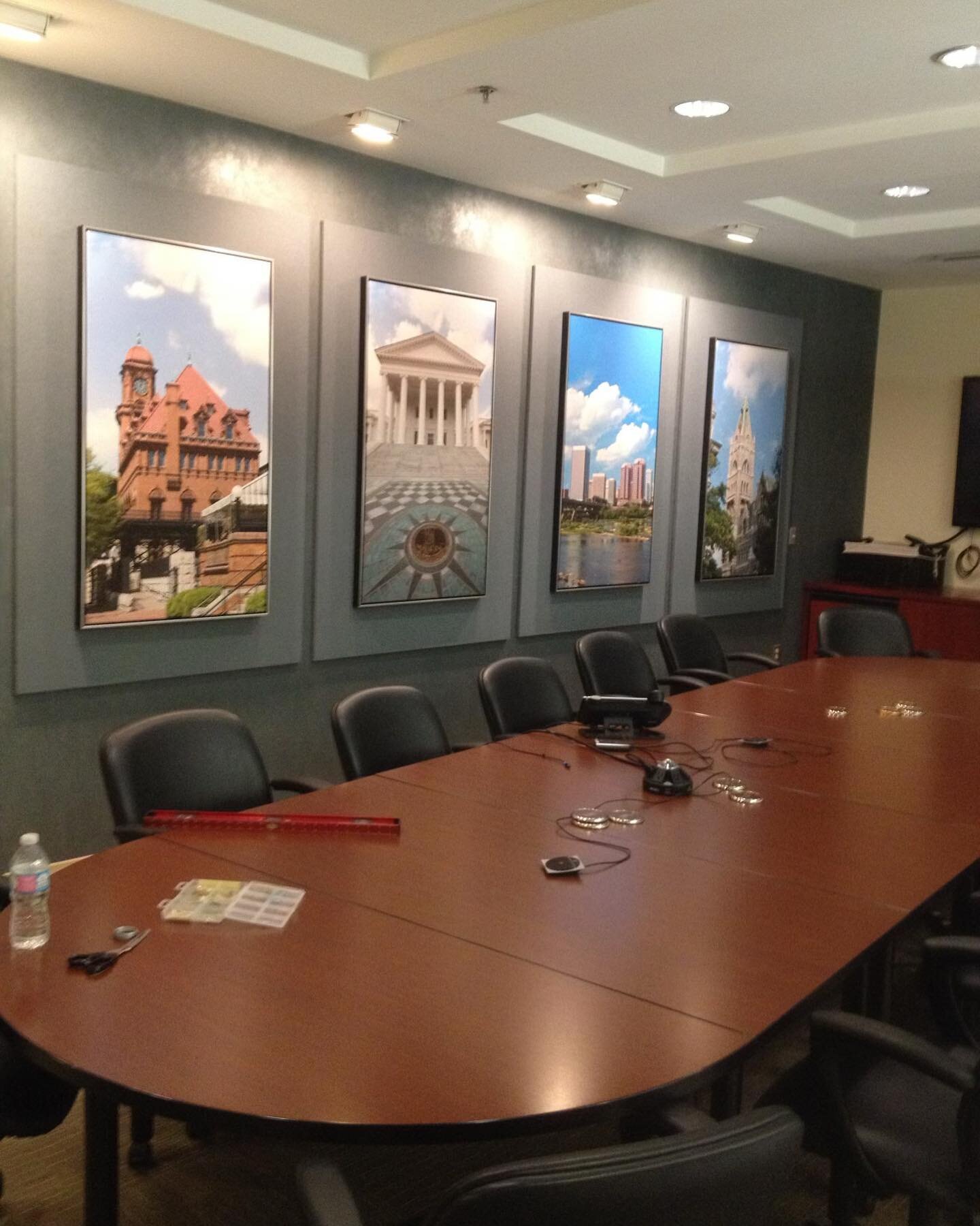 Custom Conference Room Artwork 🖼️

Our client&rsquo;s corporate conference room in Richmond had acoustical panels on one of their walls. We custom printed photographs of places in Richmond on canvas and framed to the exact size that would fit the ac