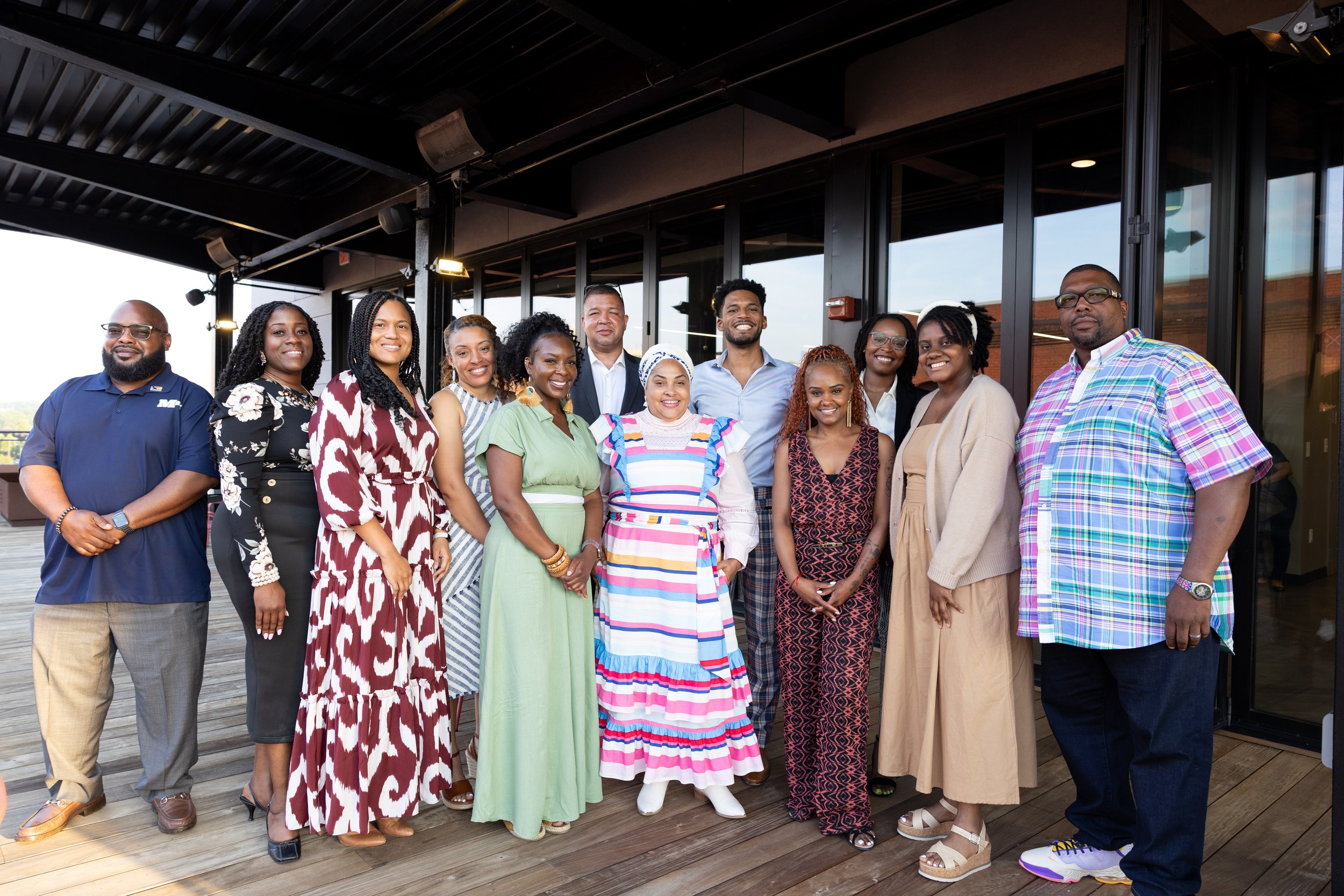 Graduation photo of our incubator's Spring 2024 cohort. 12 graduates are pictures