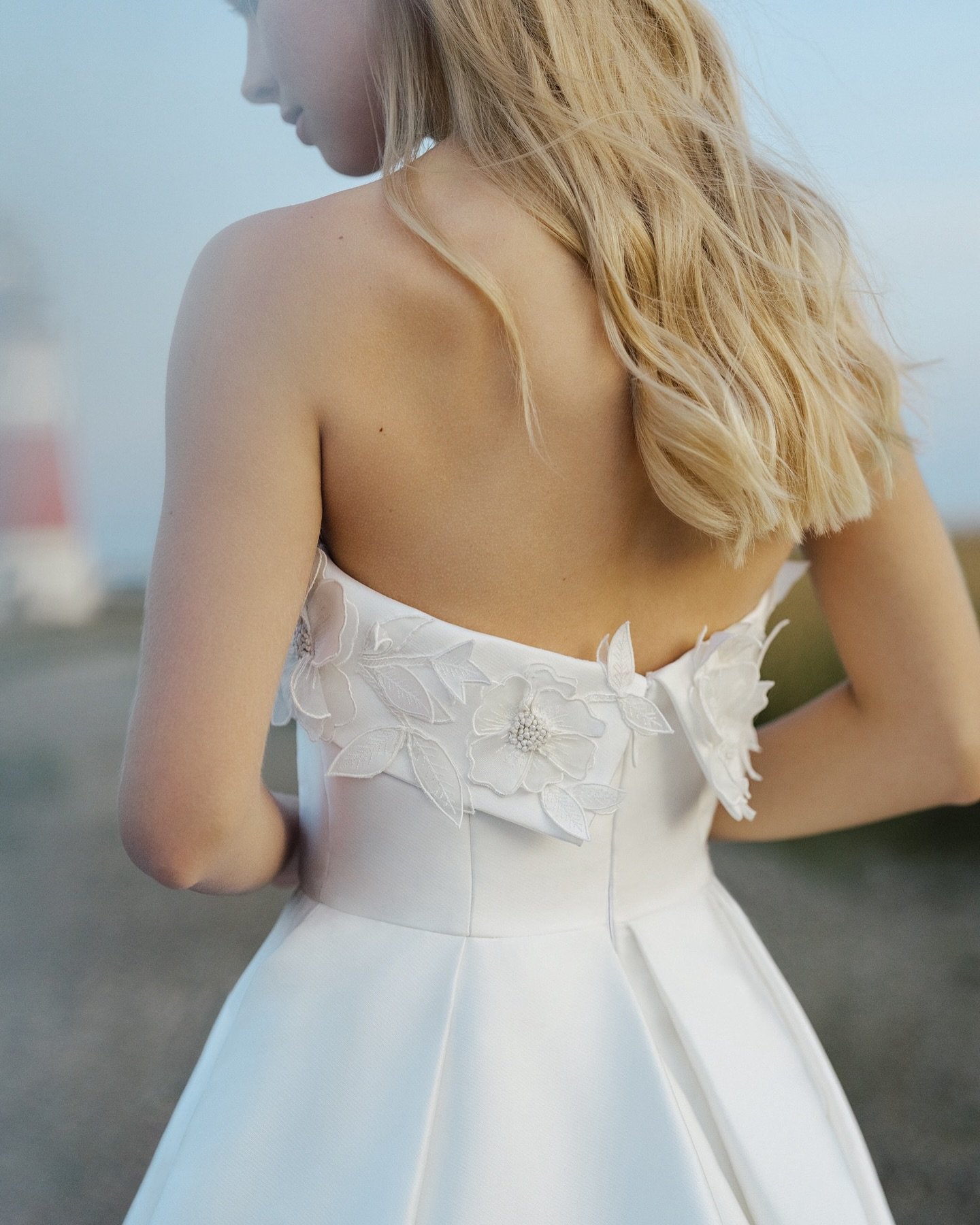 Burke : an elegant, pleated gown with captivating organza floral appliqu&eacute;s. 

Request an appointment online to make your dream gown a reality 🤍