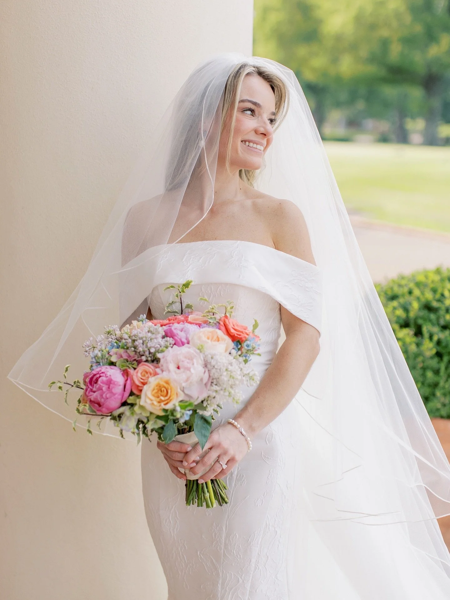 Jaci in her beautiful off-the-shoulder dress - truly THE moment!

ML Bride: @jacismiller
Photography: @taylorsquare_weddings
Planning: @monadunlap_events
Rentals: @whitedoorevent
Cake: @the_flour_garden
Florals: @lefleurmemphis
Band: @infinityshowban