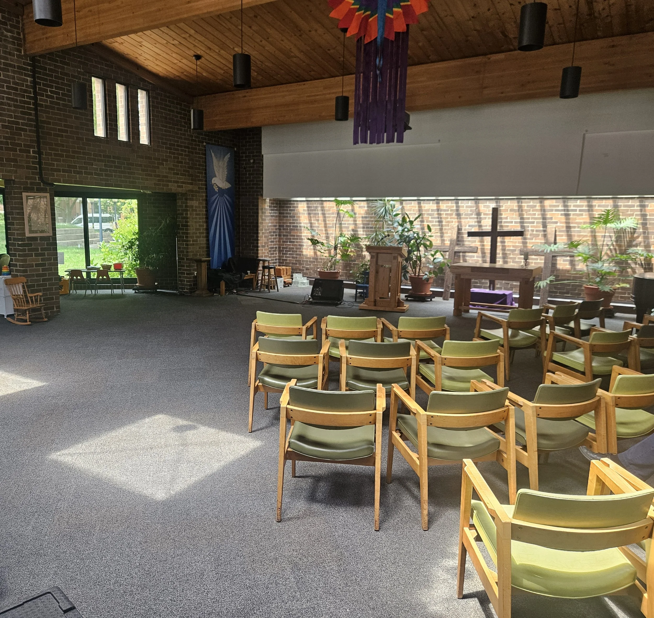 The Church of the Three Crosses sanctuary is  a large space flooded with natural light and accents of wood and brick, bringing the character of historic Old Town Triangle into the church setting.