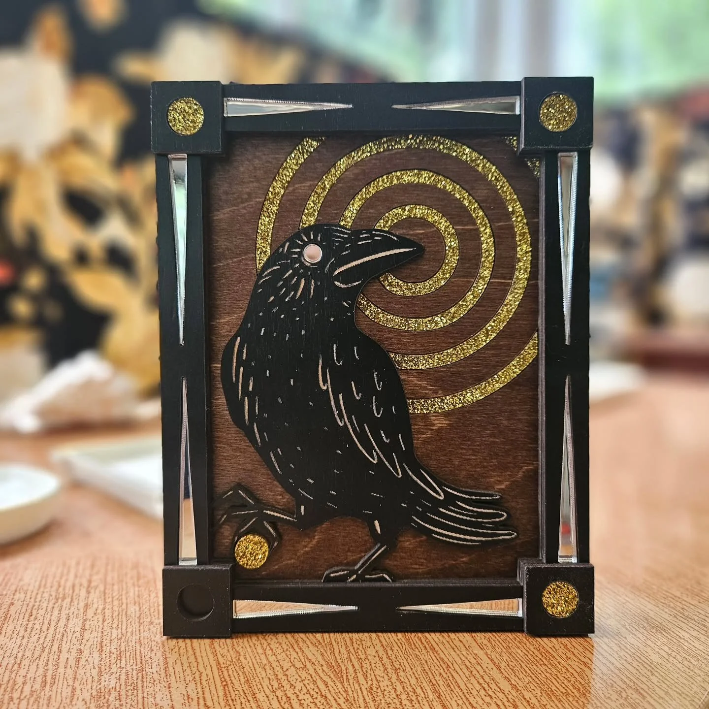 The Crow Thief is now up in both my online shop and Etsy ✨️ I originally designed this piece for @artlabsi GOLD show, inspired by the myth that corvids love to collect shiny things.  It is a combination or layered laser cut wood, glitter acrylic and 