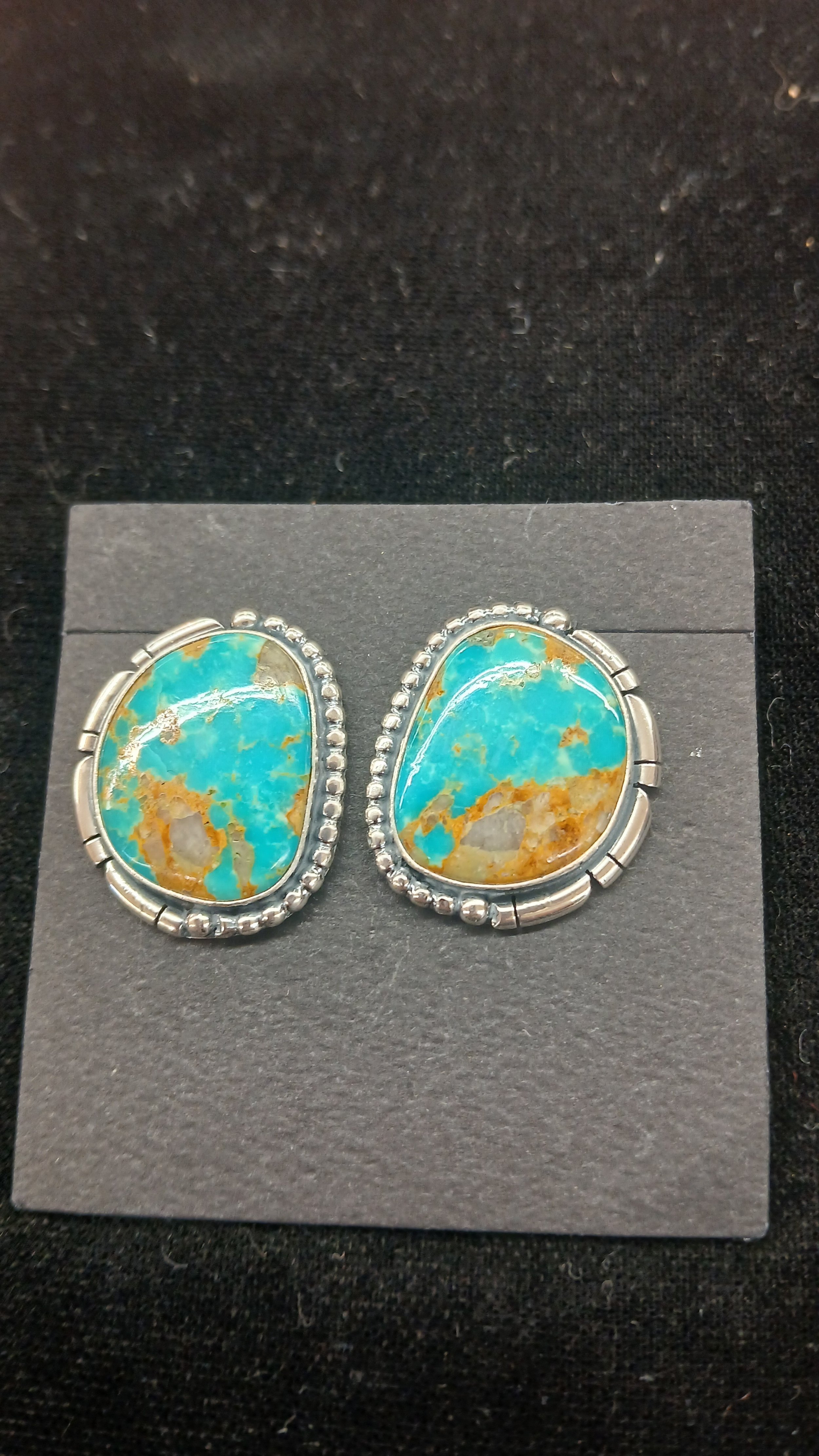 Navajo handmade sterling earrings with Kingman turquoise cabochons  various shapes