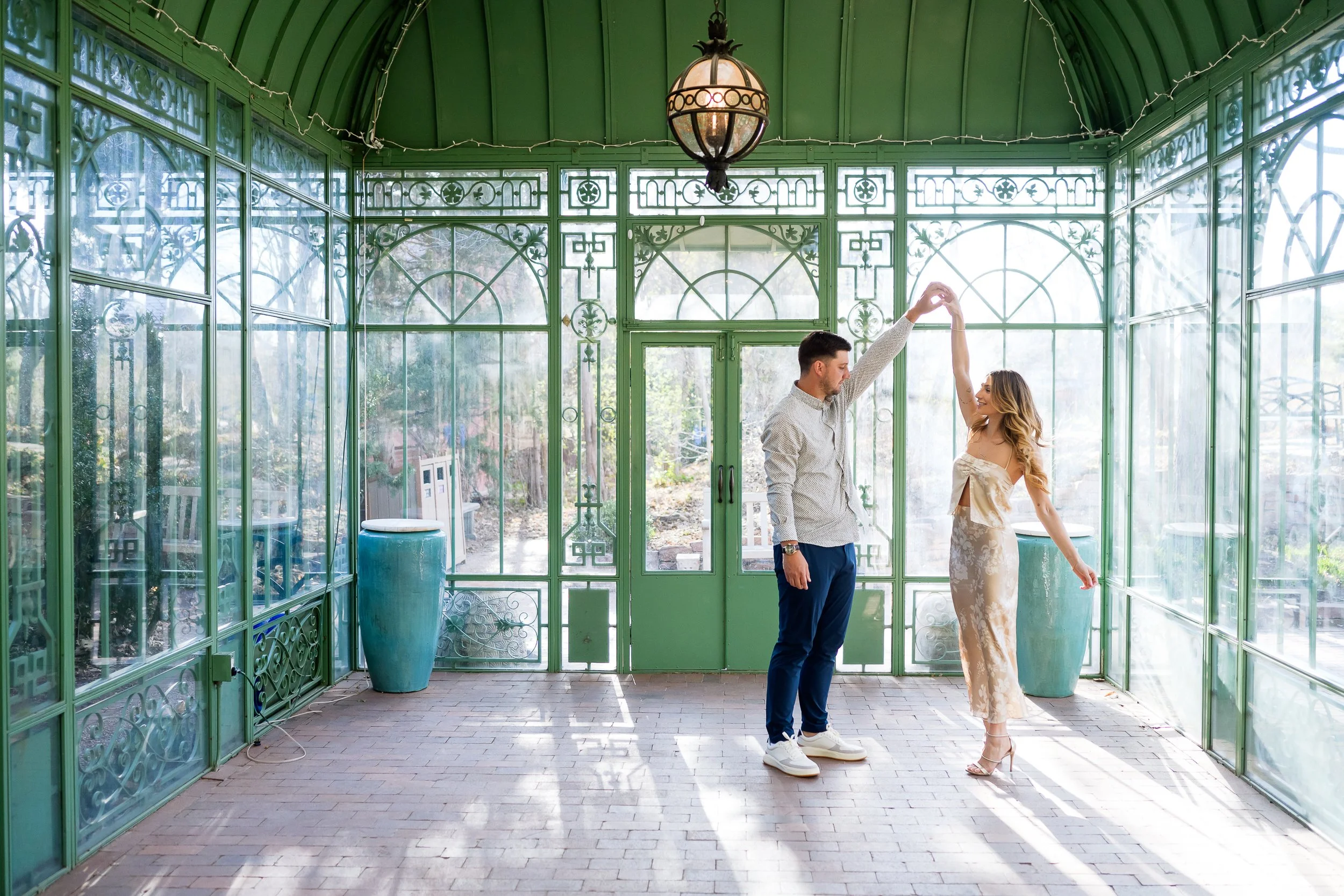 Couple dances together at the Botanic Gardens in Denver