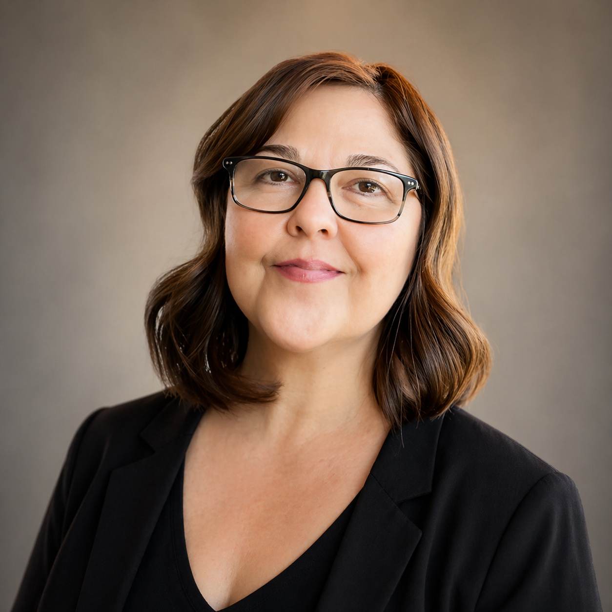 professional photo of Julianna Silva, founder of Silva Strategies, who helps women business owners with business