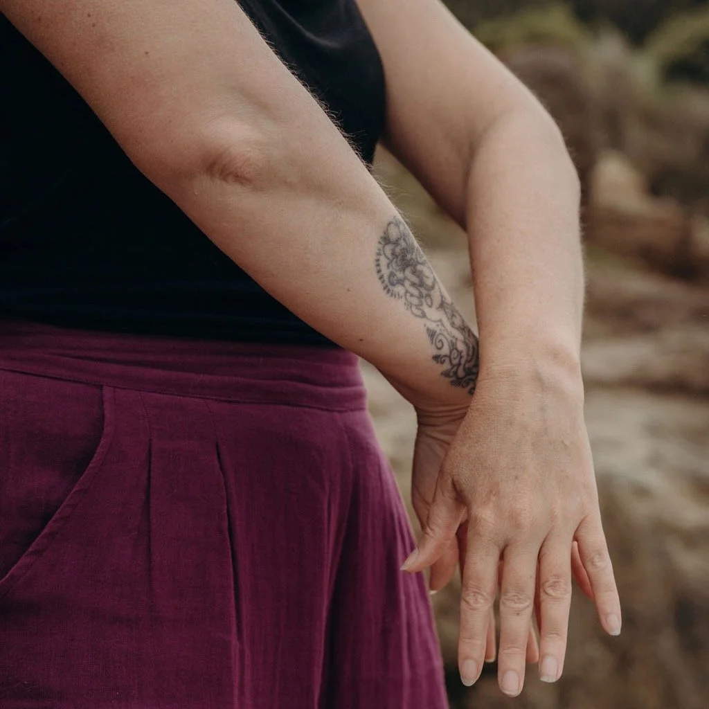Person practising Qigong with attention on the sensations in the hand and body