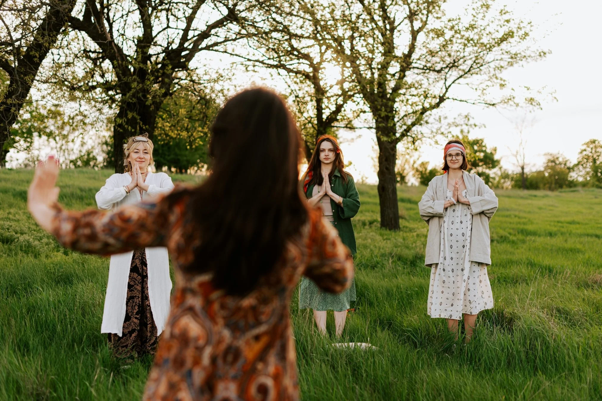 Qigong group practice outdoors showing breathwork, awareness and energy cultivation