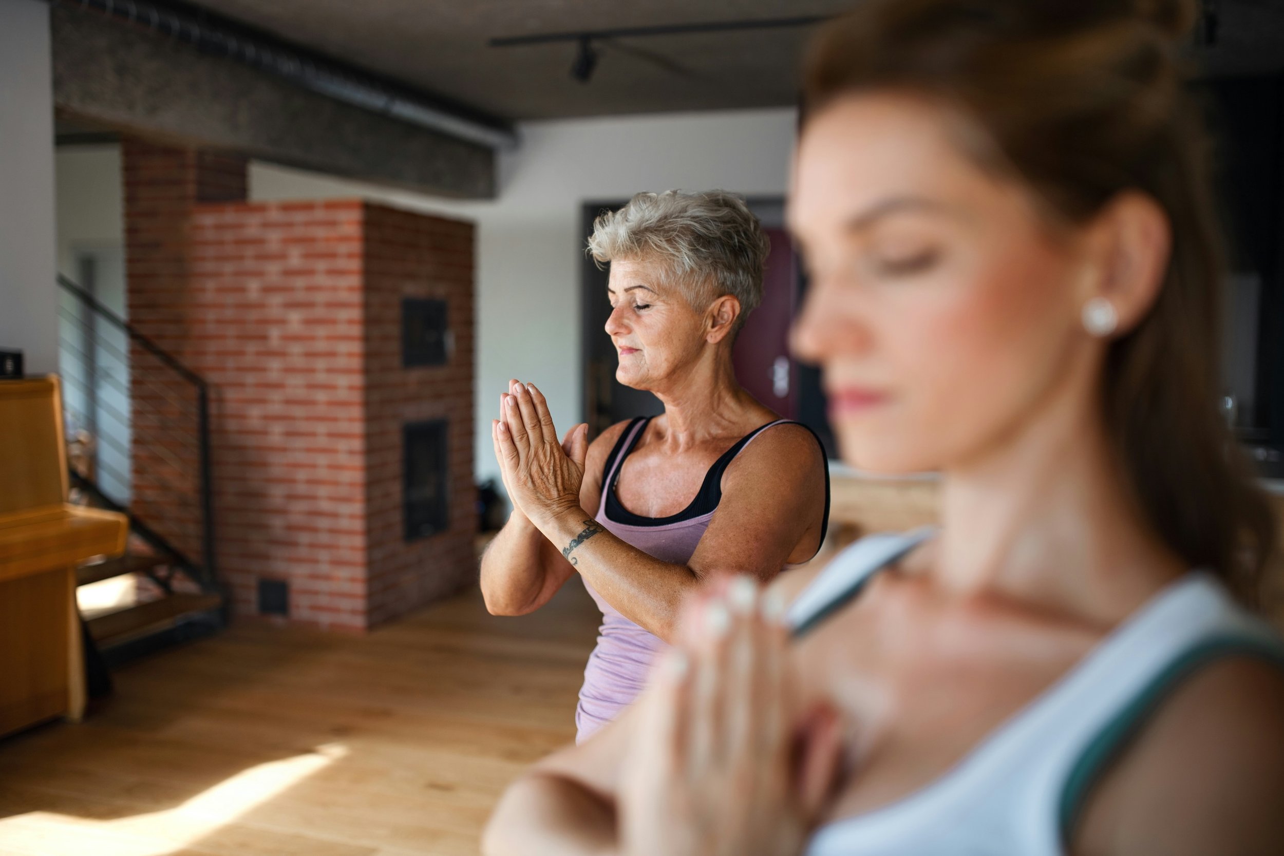 Women practising gentle Qigong to support emotional wellbeing and nervous system regulation