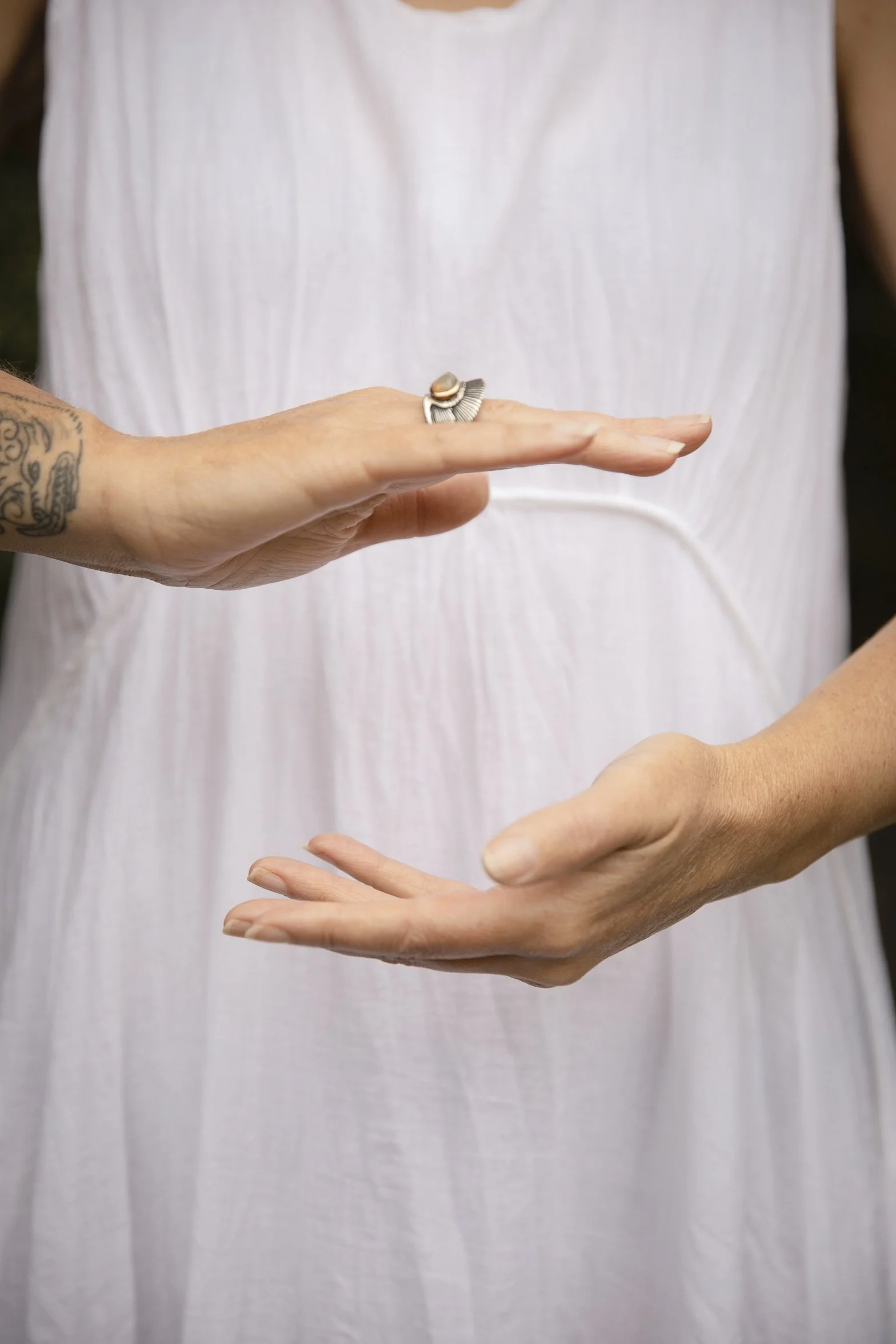 Hands positioned in a Qi Healing practice, demonstrating the use of focused hand placement and awareness in working with Qi.