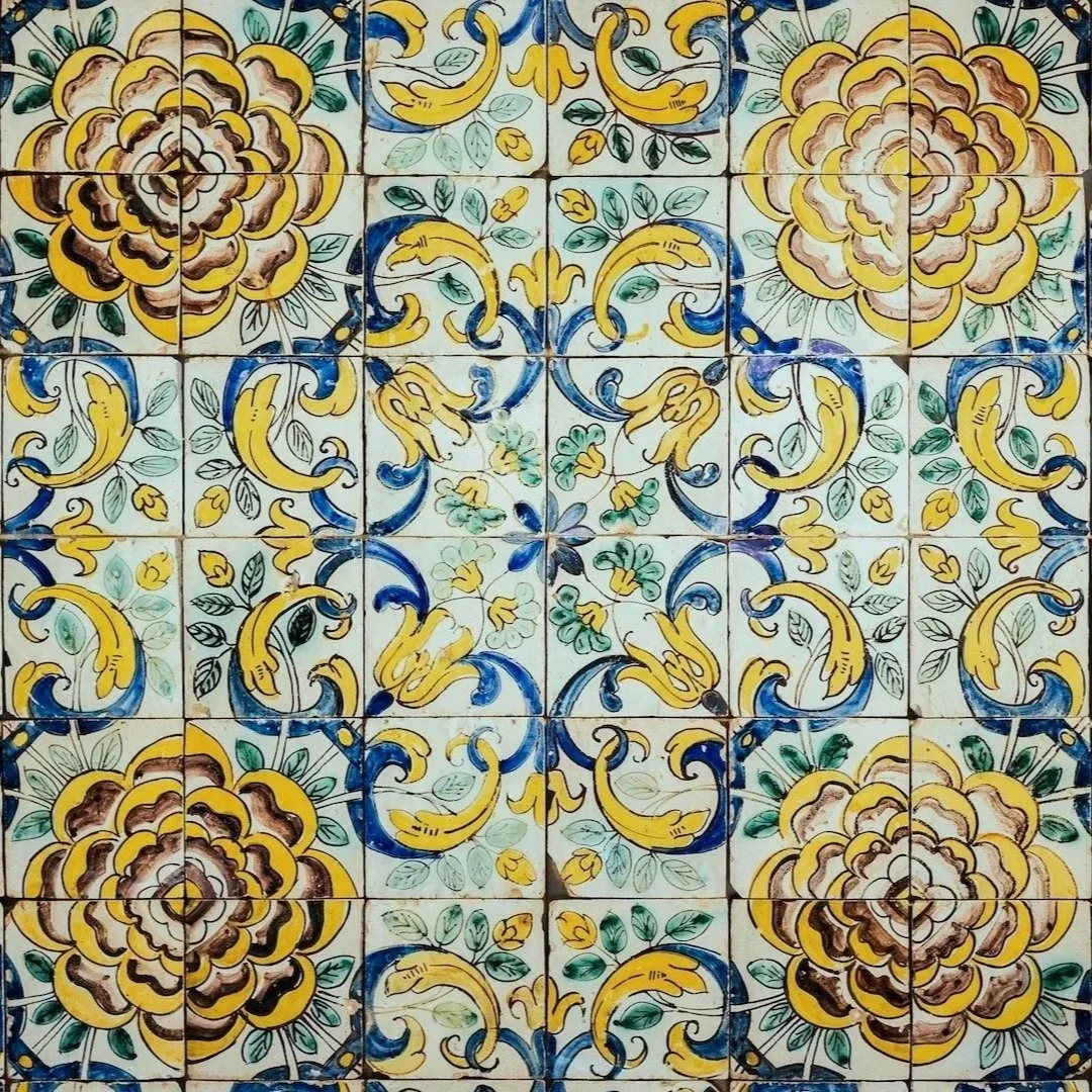 Traditional Portuguese decorative tiles in blue, yellow and green for the Flow into Freedom yoga and Qigong retreat in Portugal
