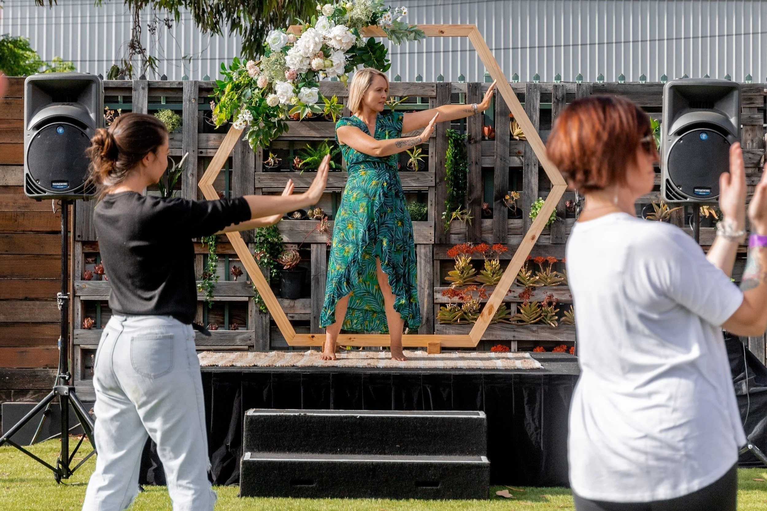 Nicole Lee teaching Qigong to students during an outdoor practice session