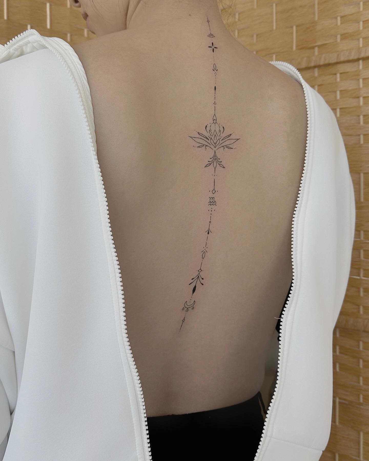 A moment of silence for this beautiful custom spine piece😍

We added different elements that was meaningful to the client and created this together. Spine tattoo is often difficult to place since our spine isn&rsquo;t perfectly straight. We like to 