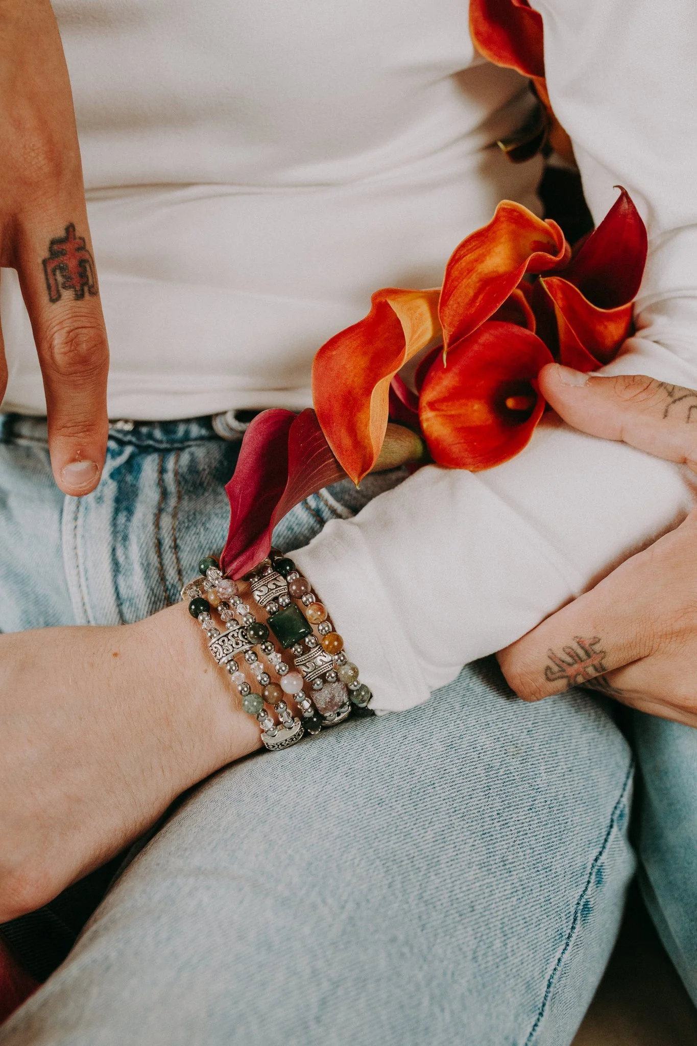 A close up of someone wearing bracelets 