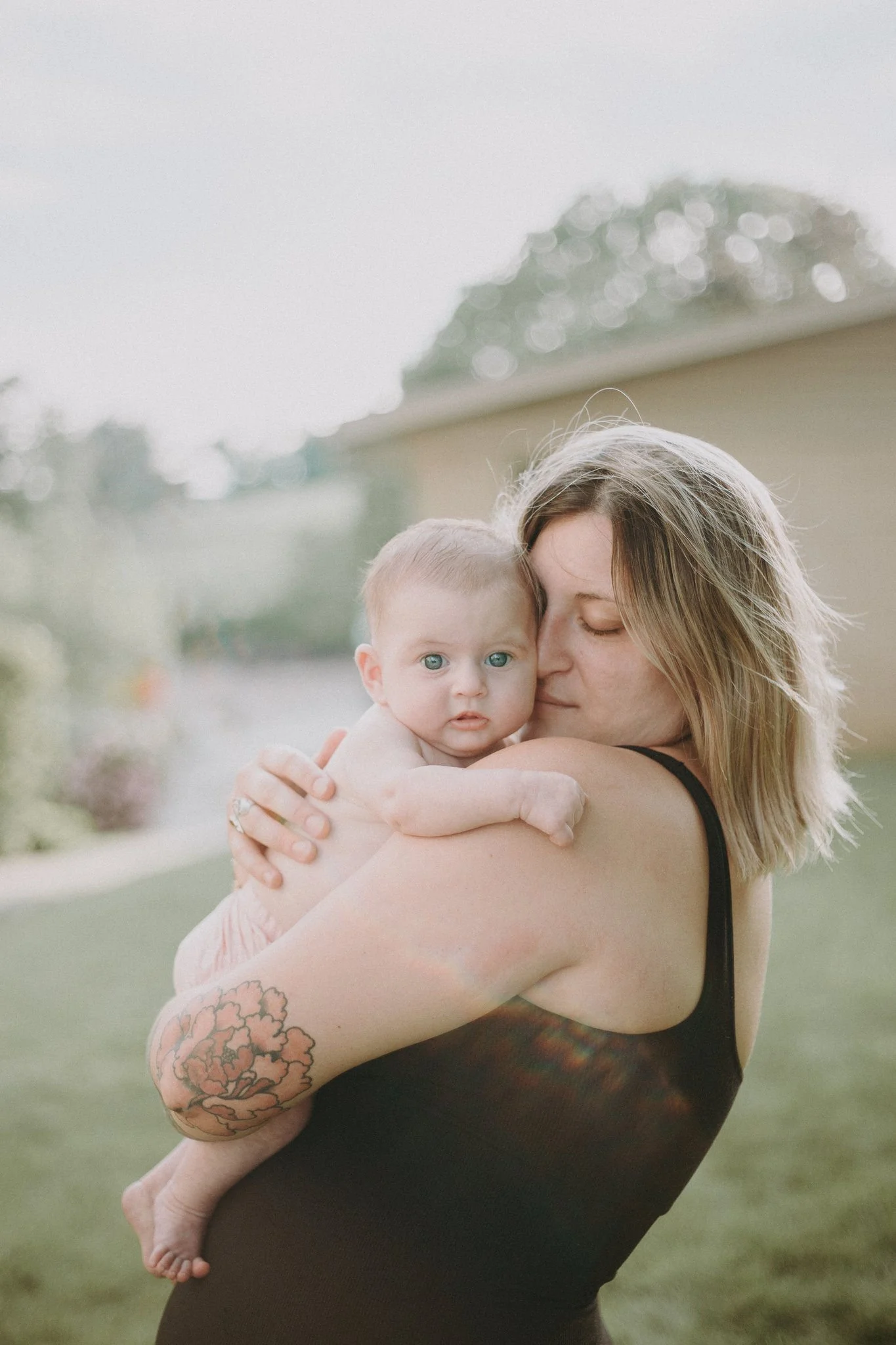 A parent holding their baby 