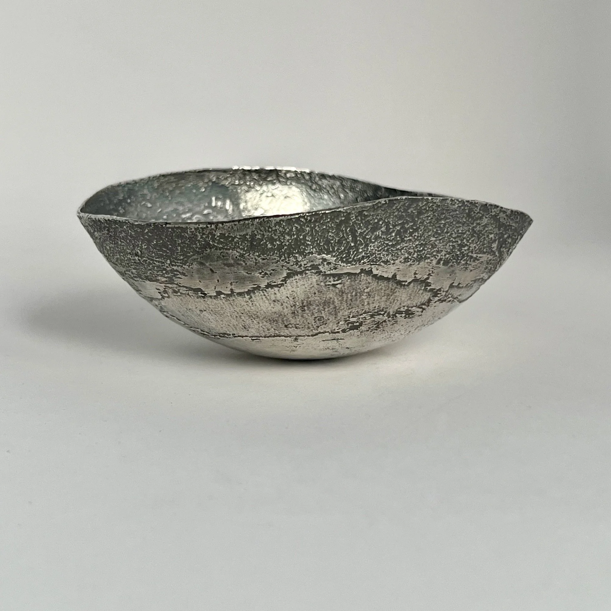 An etched copper bowl plated in silver