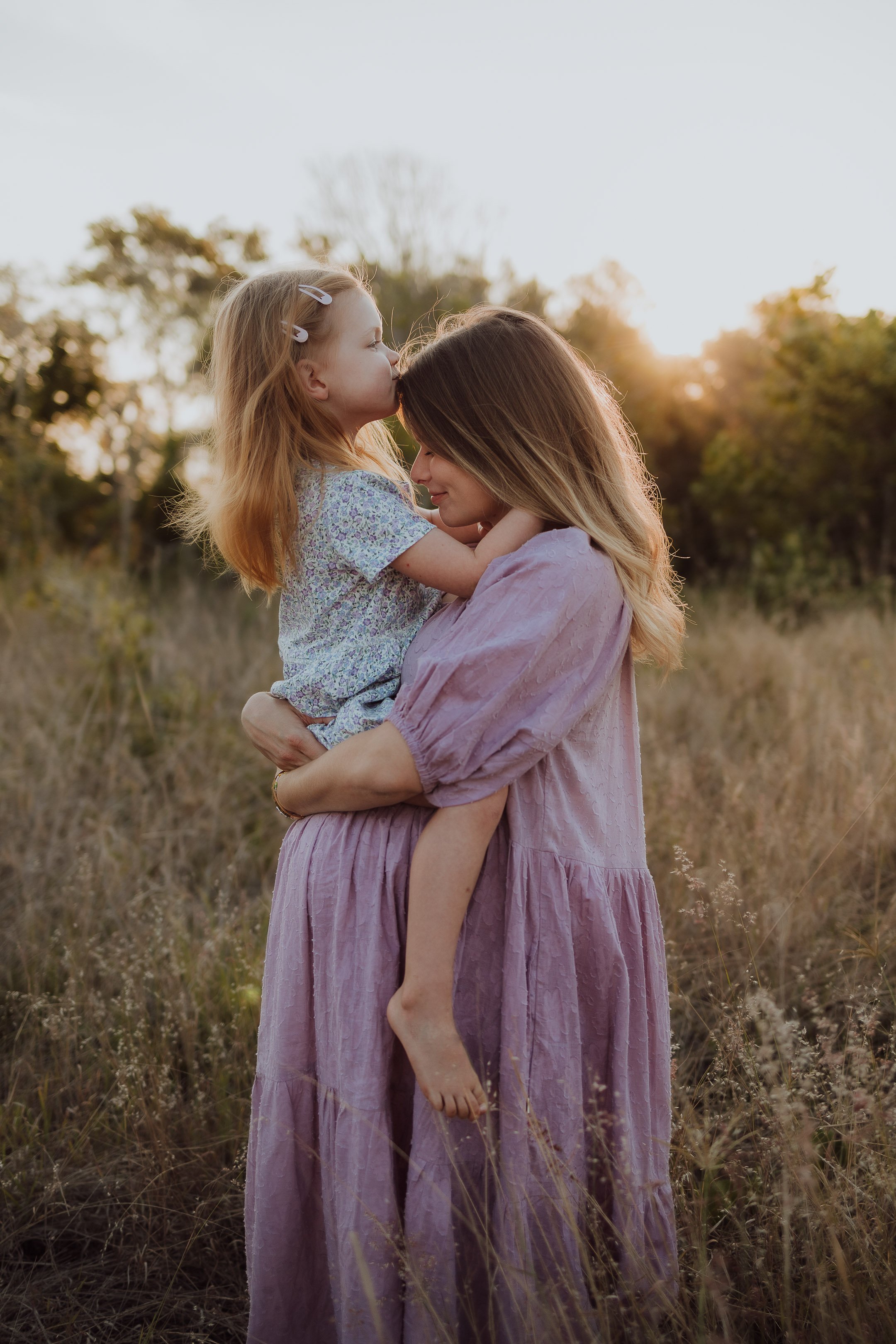 Pregnant mother and daughter sunset photoshoot motherhood