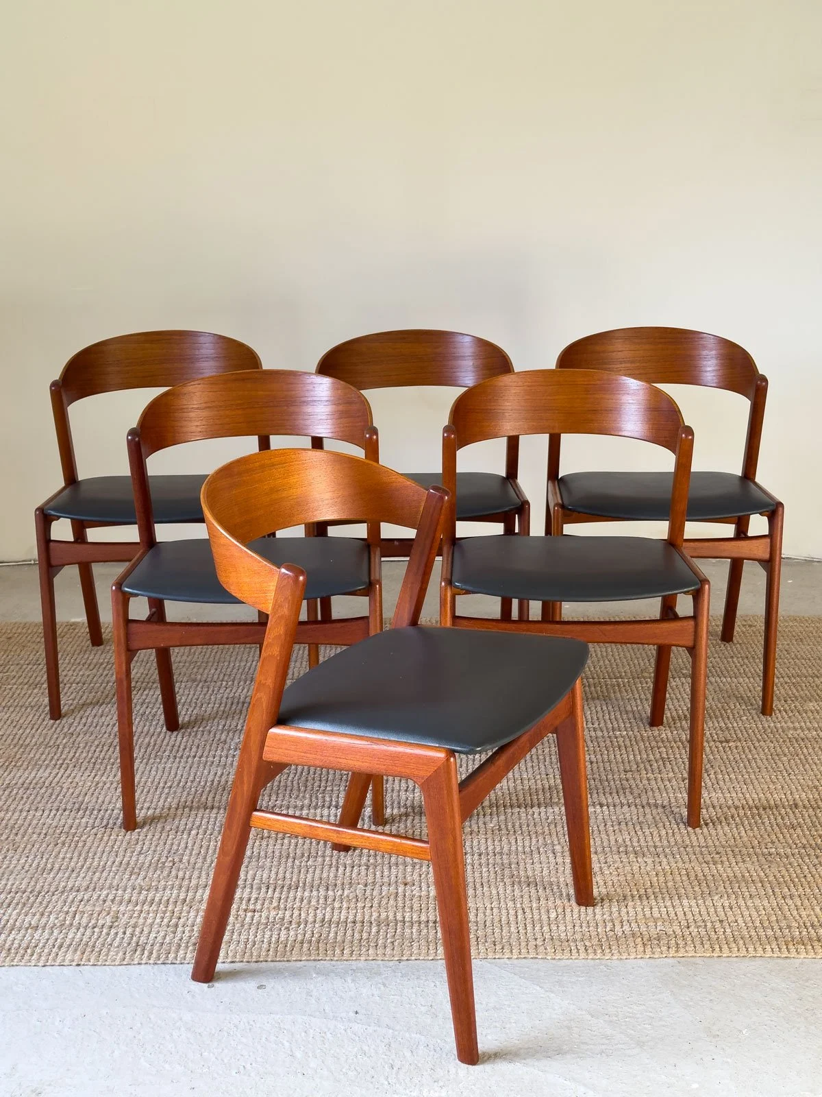 “Set of six Erik Kirkegaard dining chairs arranged together in solid teak”