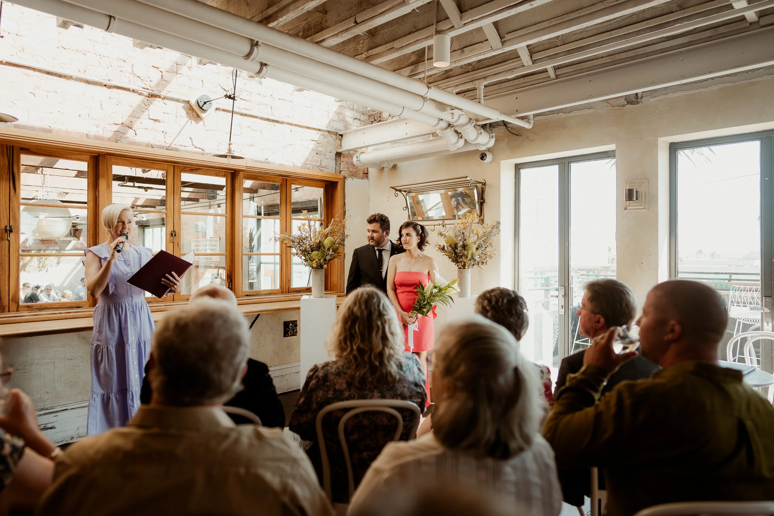 A celebrant conducts the ceremony in the Balcony Bar of the Espy St Kilda