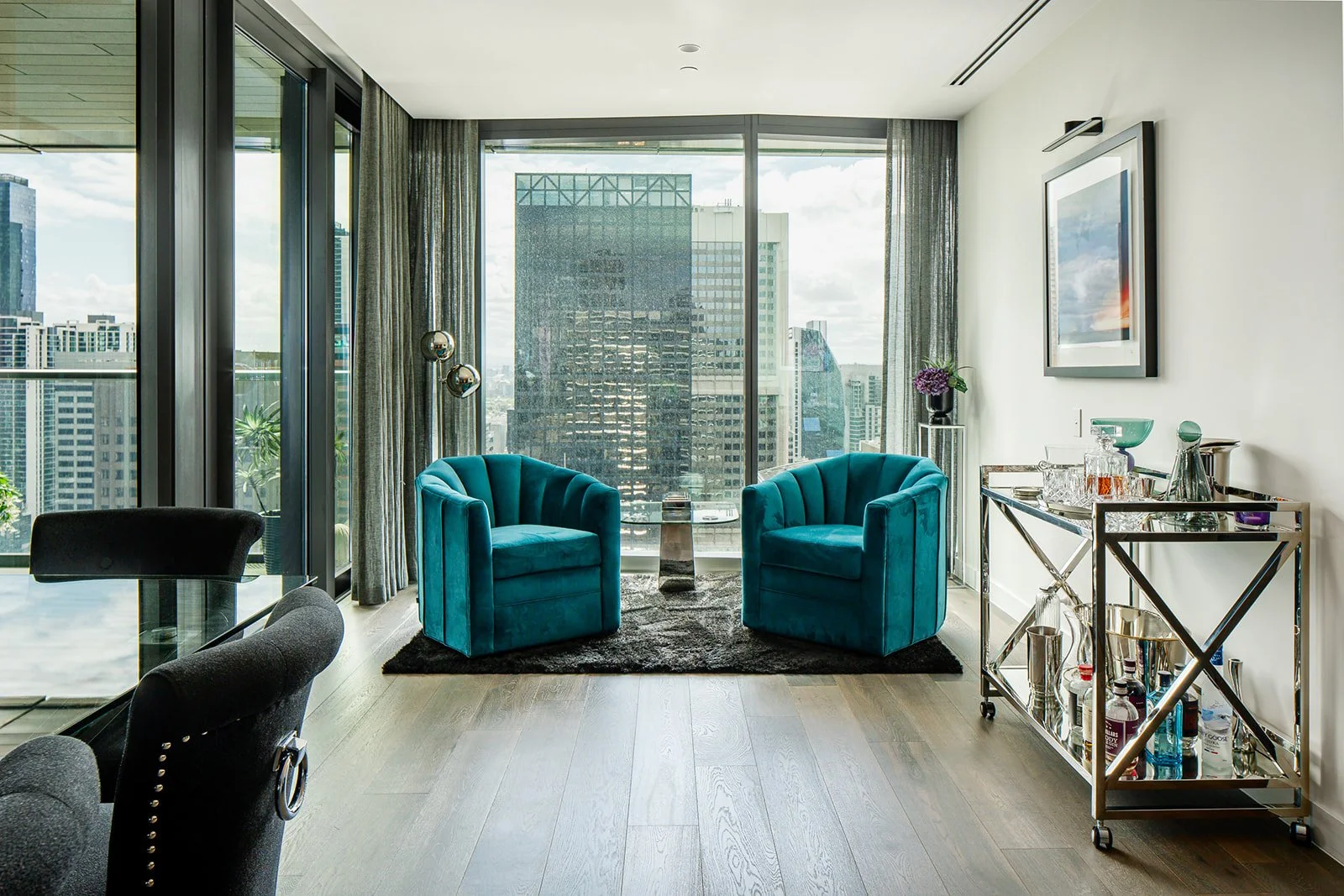 Perfect one point perspective shot of a modern sitting area in a high rise apartment in Melbourne
