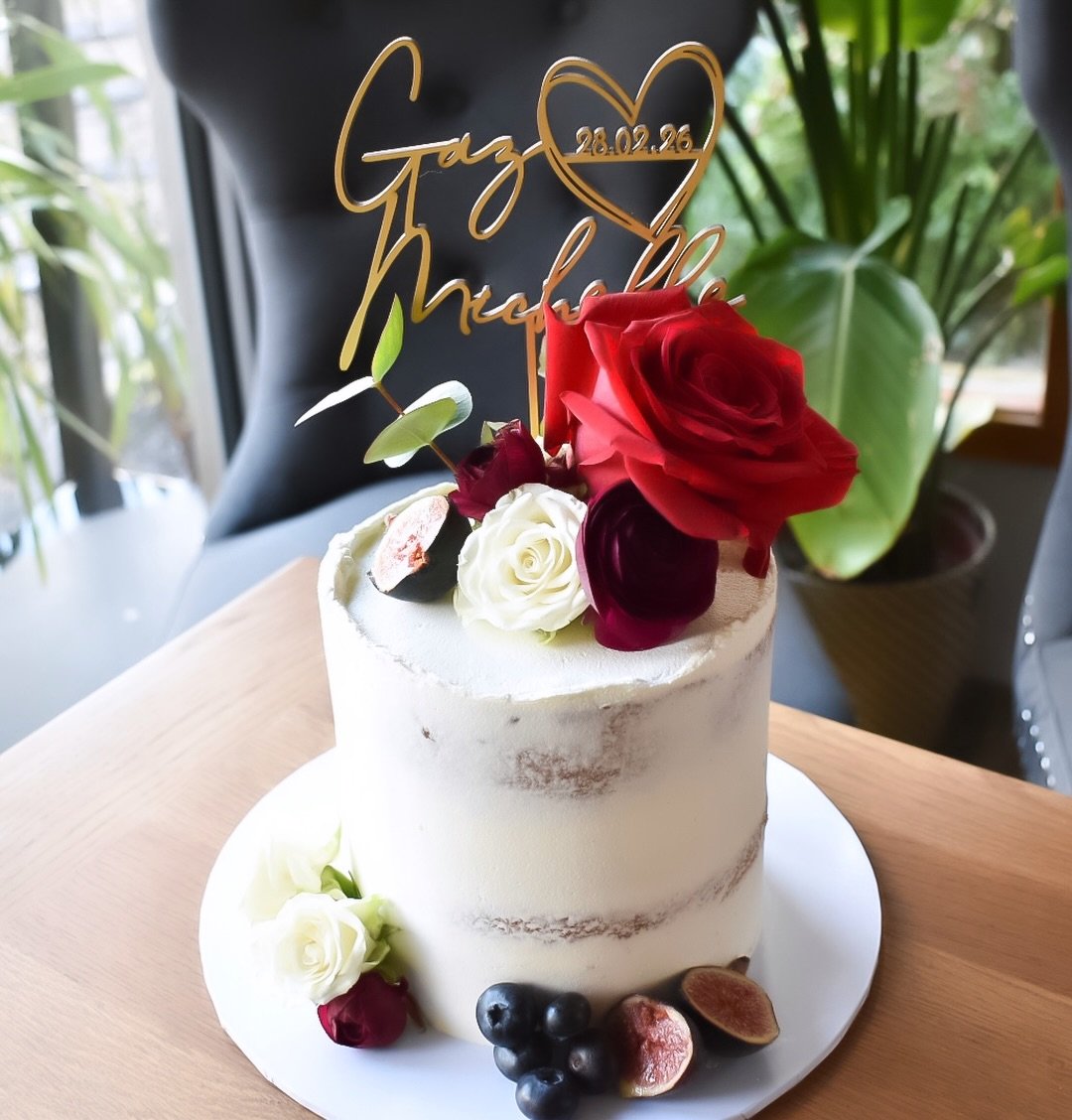 Some weddings are grand.
Some are beautifully intimate.

This elegant single-tier elopement cake was created for Gaz &amp; Michelle, finished with fresh florals and filled with white chocolate &amp; raspberry - a perfect pairing for a day focused pur