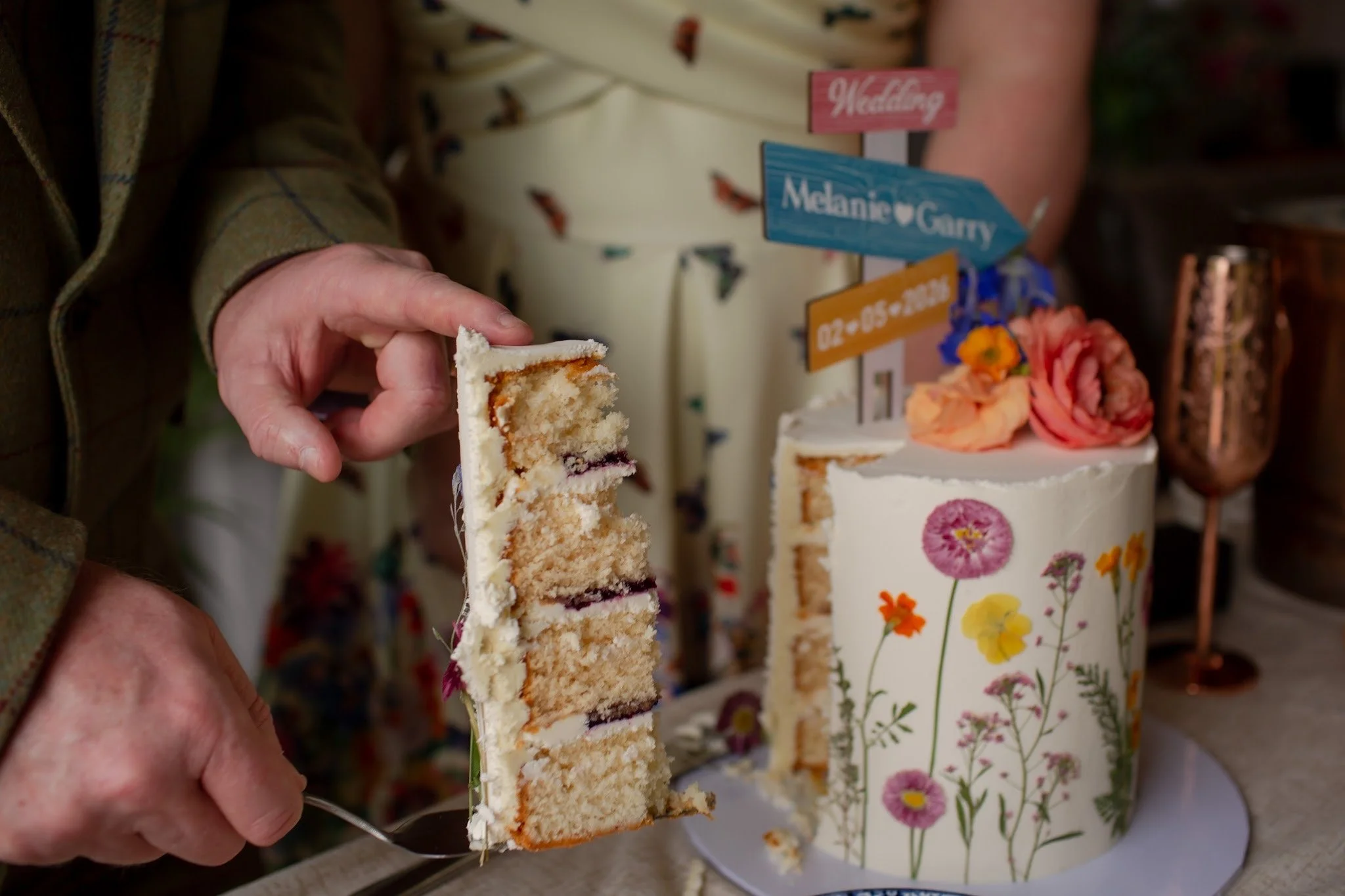 Wedding cake cutting - an elopement wedding in Devon.