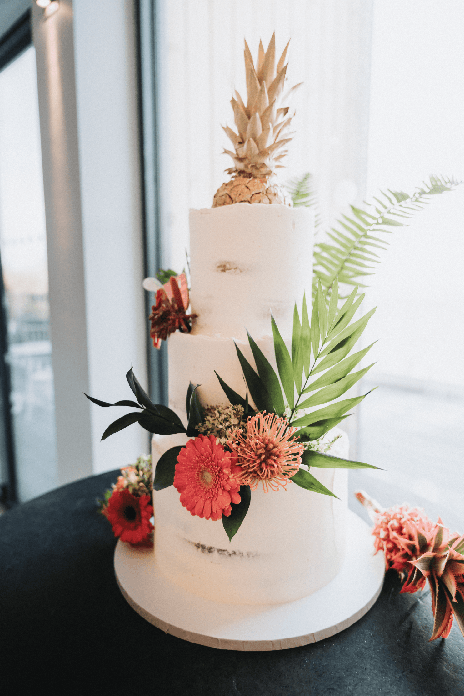 Tropical themed wedding cake by Lulu's primrose Bakery.