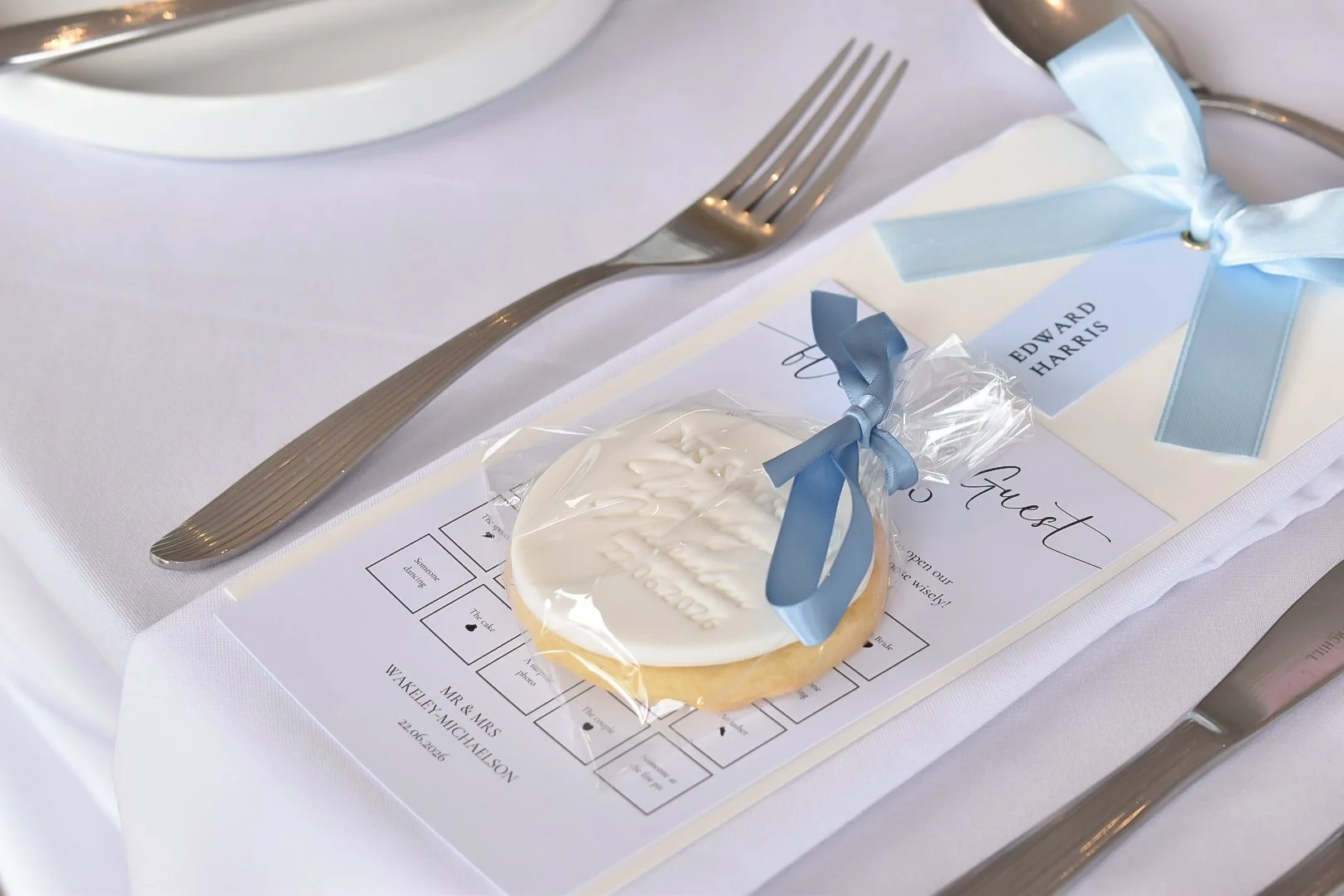 Personalised iced biscuit wedding favours with bride and grooms initials.