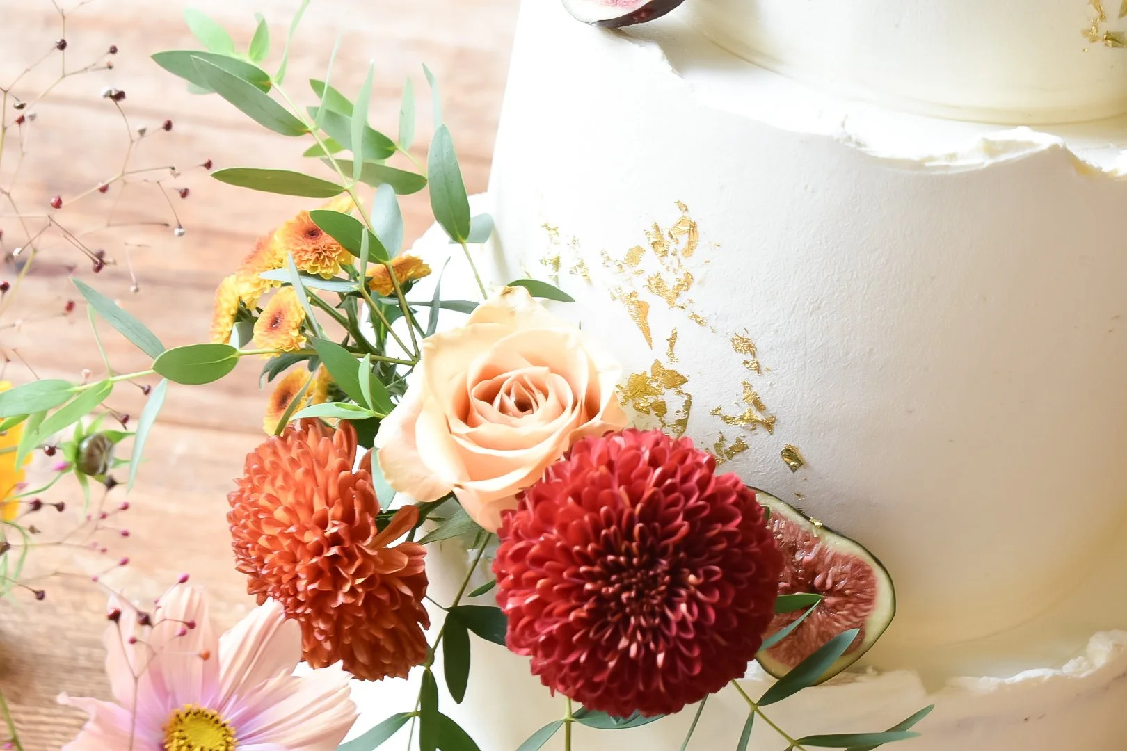 Autumnal themed semi-naked wedding cake with table styling in Devon, Cornwall and Central London