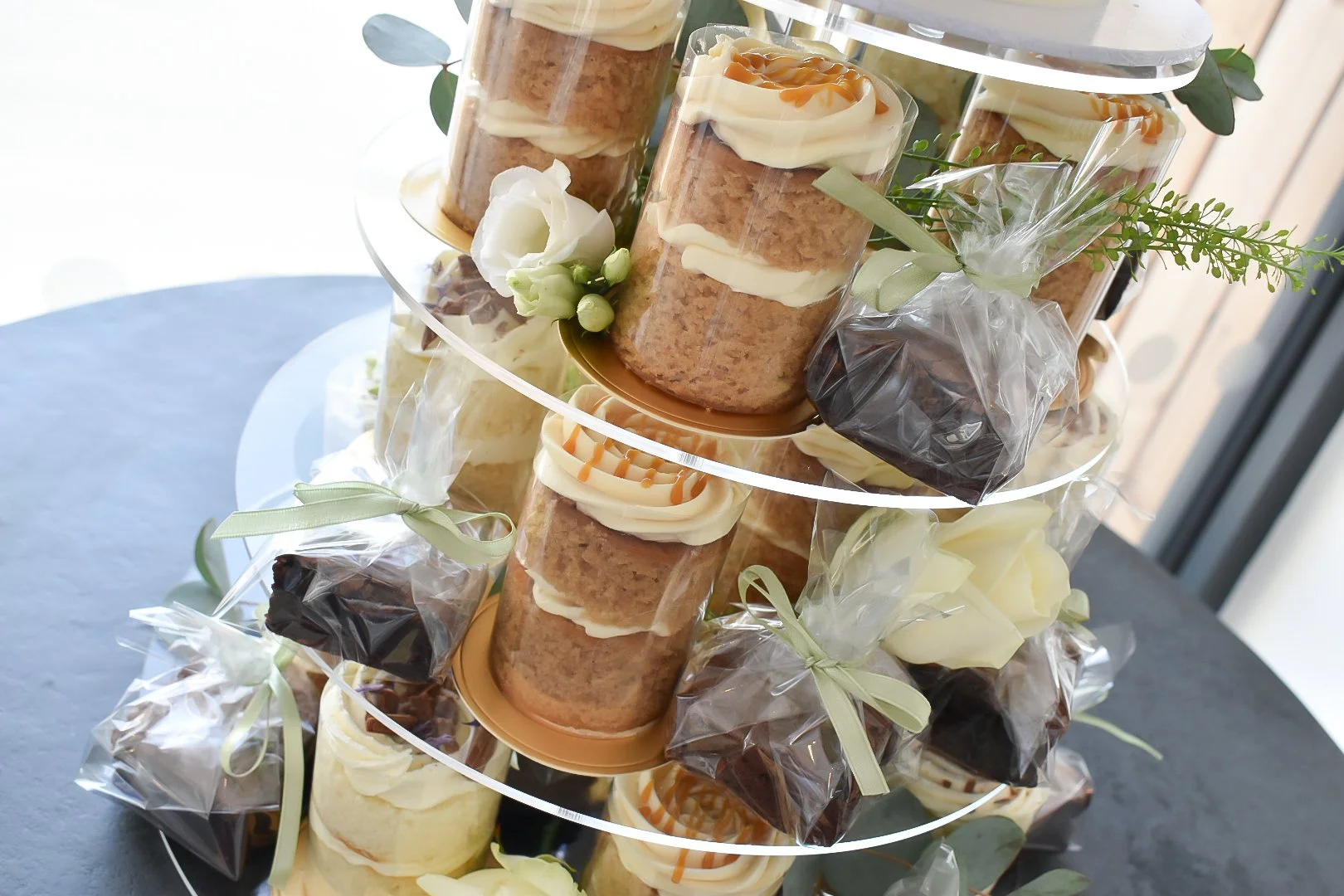 Mini-cakes and brownie wedding display.