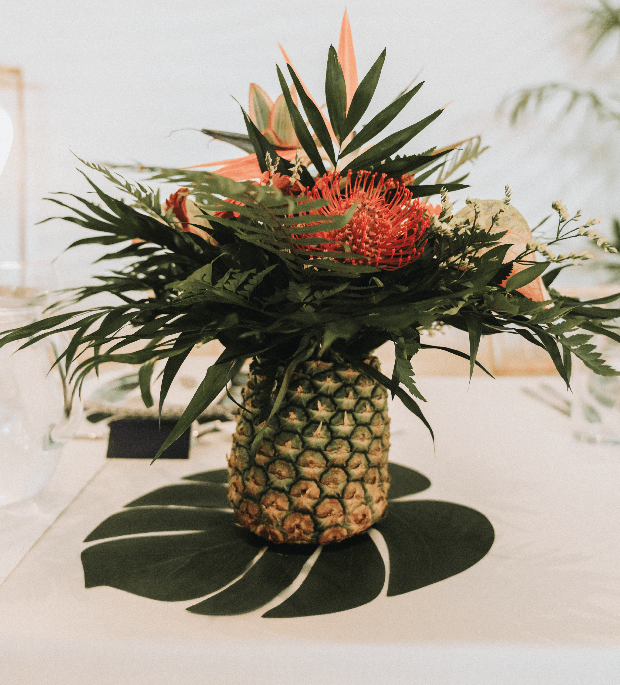 Tropical themed wedding table arrangement.