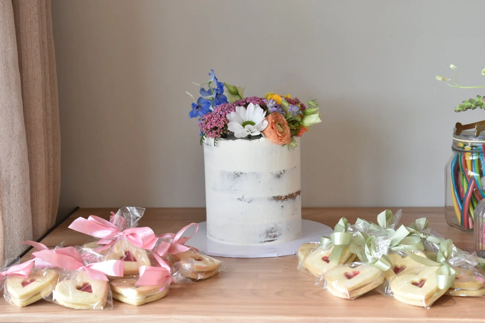 Elopement wedding cake decorated with fresh wild flowers.