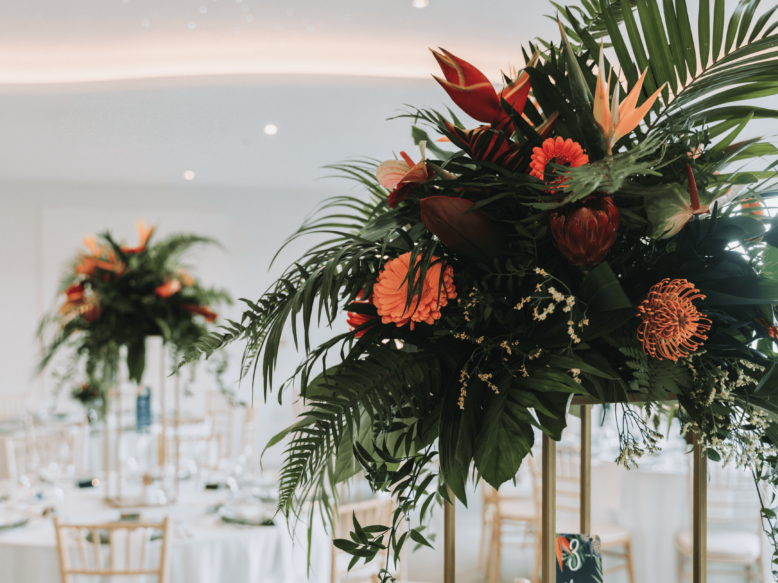 Tropical themed wedding decor and flowers.