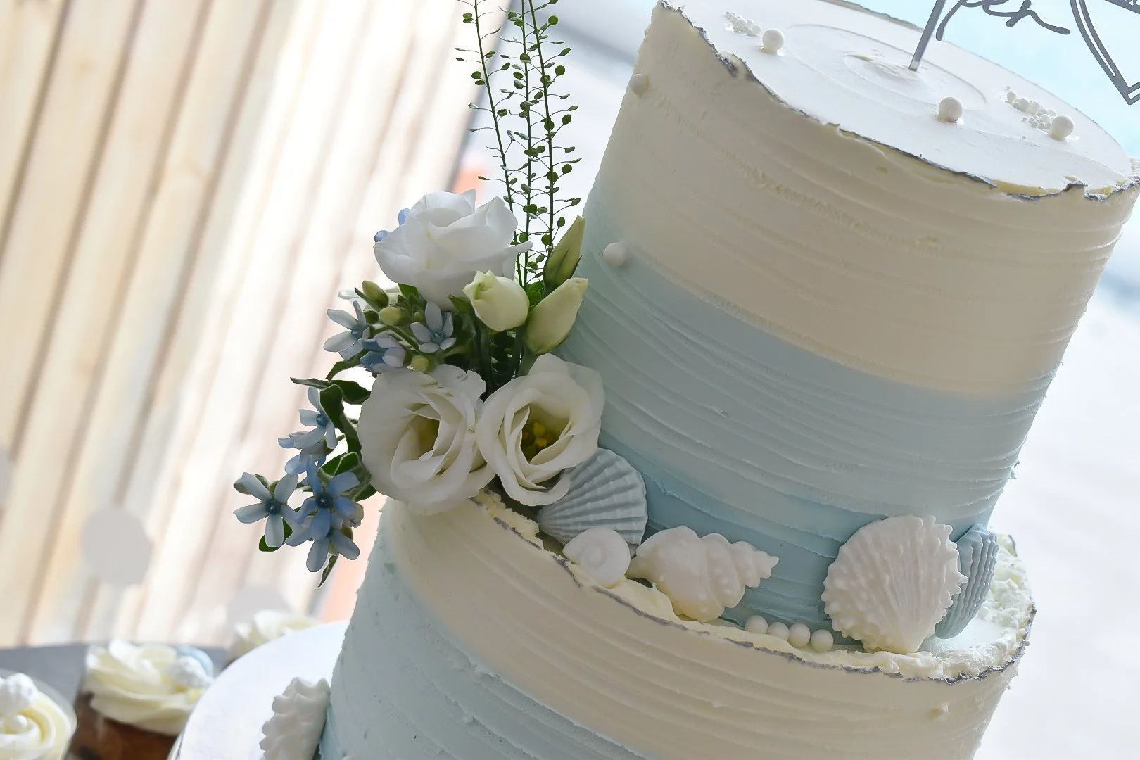 Beach wedding cake with handmade sea-shells.