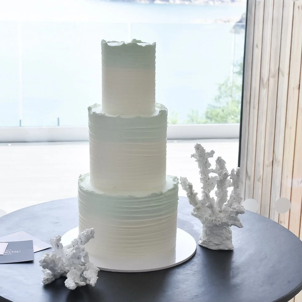 Blue wedding cake with sea coral to complement the  beach themed wedding.