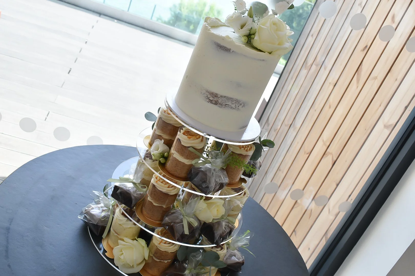 Wedding cake and mini-cake tower with brownies.