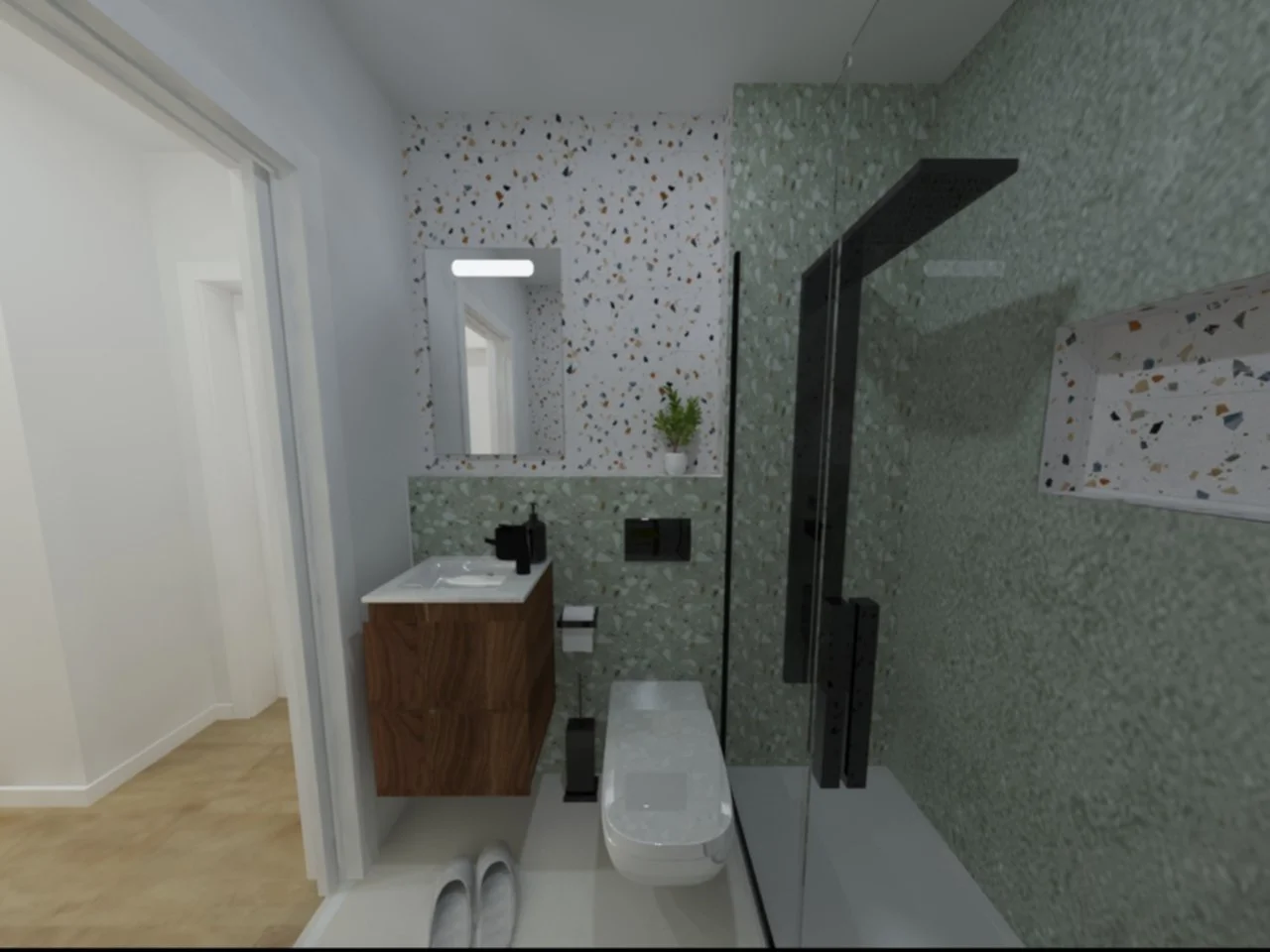 Banheiro com paredes decoradas com revestimentos de cerâmica verde e comirada, espaço com vaso sanitário, pia com armário de madeira, espelho acima da pia, plantas ao lado do espelho, e uma cabine de chuveiro com portas de vidro e detalhes escuros.