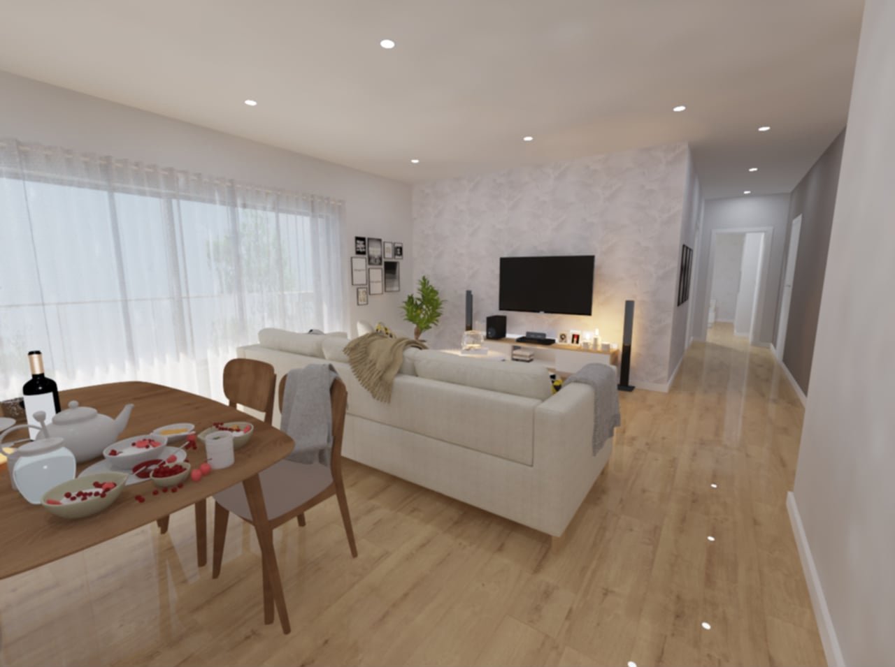 Sala de estar com sofá branco na frente de uma TV, parede texturizada, e uma mesa de jantar ao lado com pratos de café da manhã, vinho e taças.