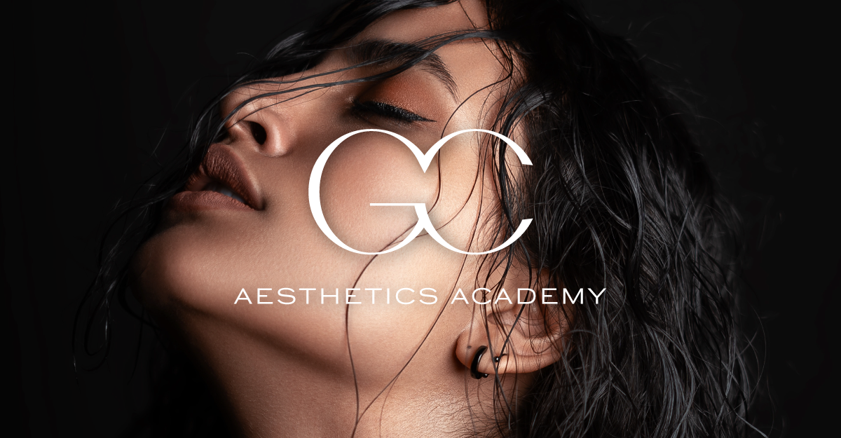 Close-up image of a woman with curly black hair and pierced ear, with a tattoo, with text overlay reading 'G Cultura Aesthetics Academy'.