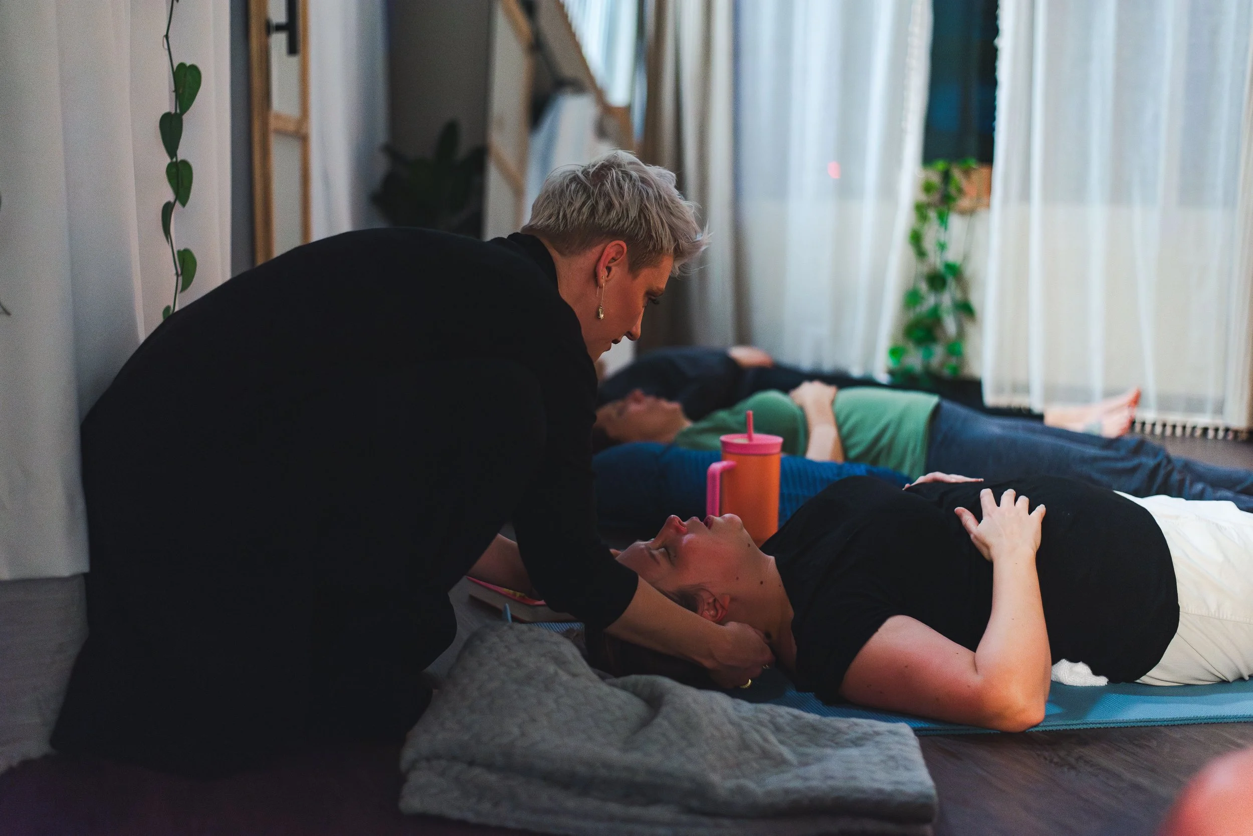 Breathwork coach helping with adjustments