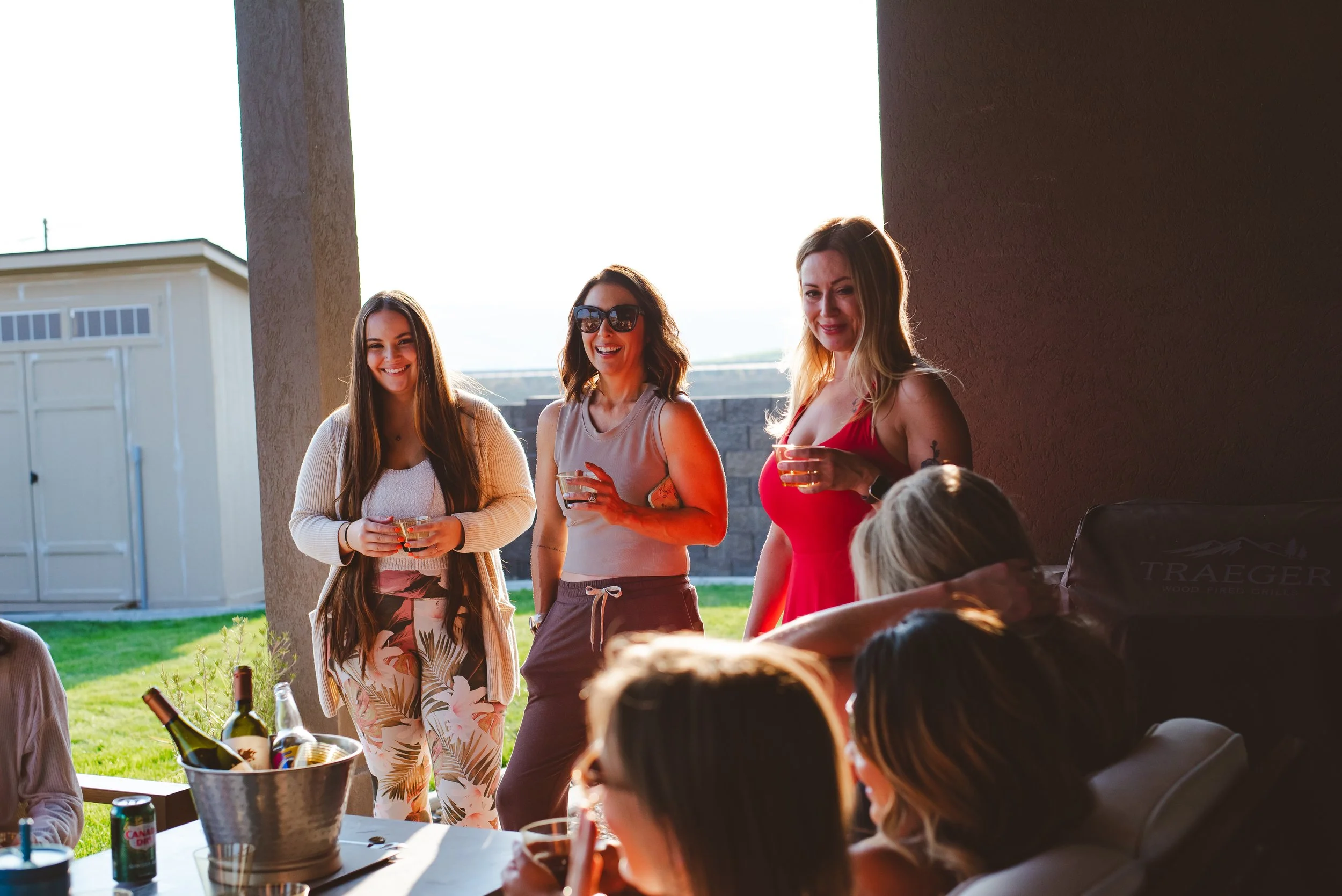 Women's retreat in Tri-Cities, WA - women standing outside on a patio laughing together.