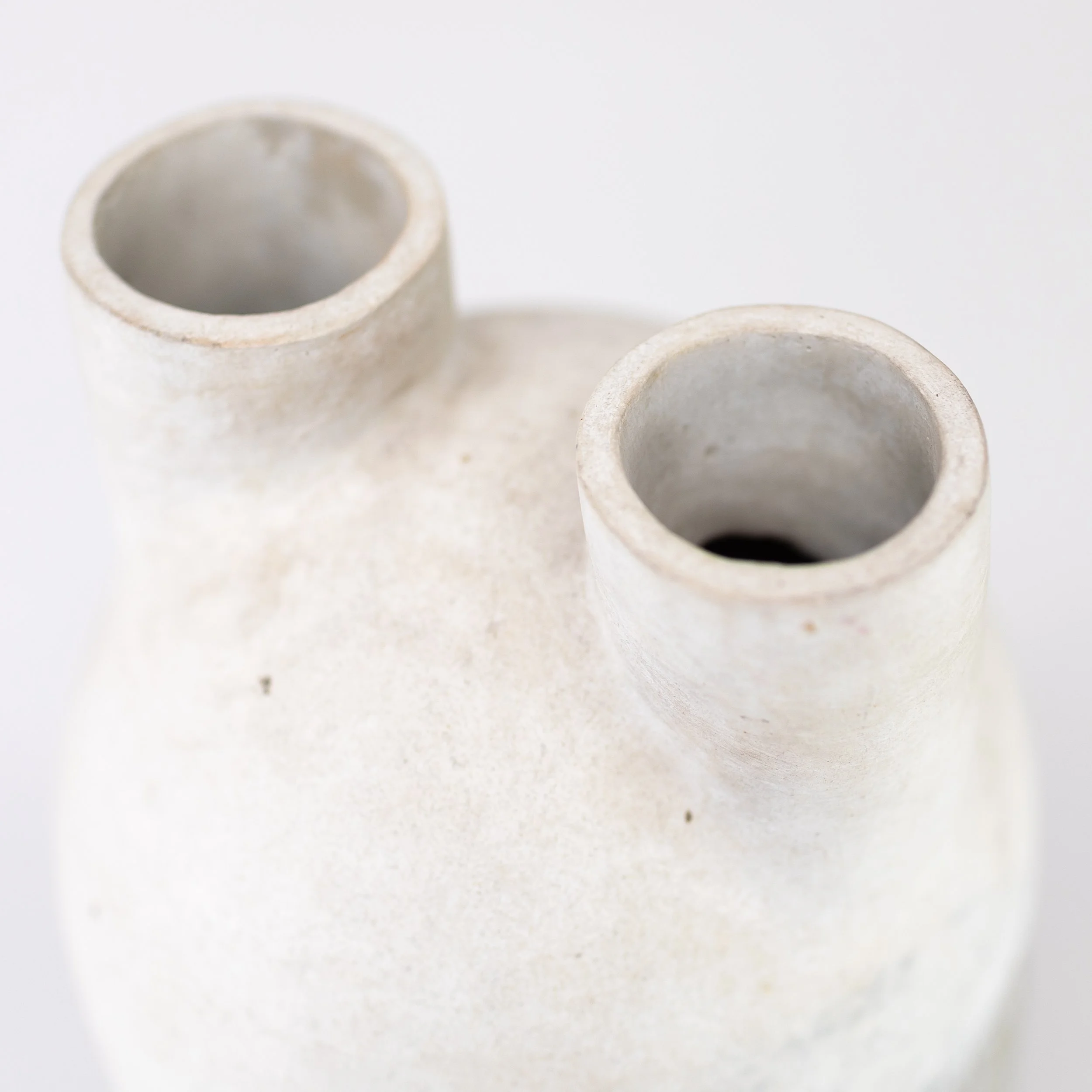 ALEX HAGEN_a tall double necked stoneware vessel partially covered in white glaze with incised decoration_10.jpg