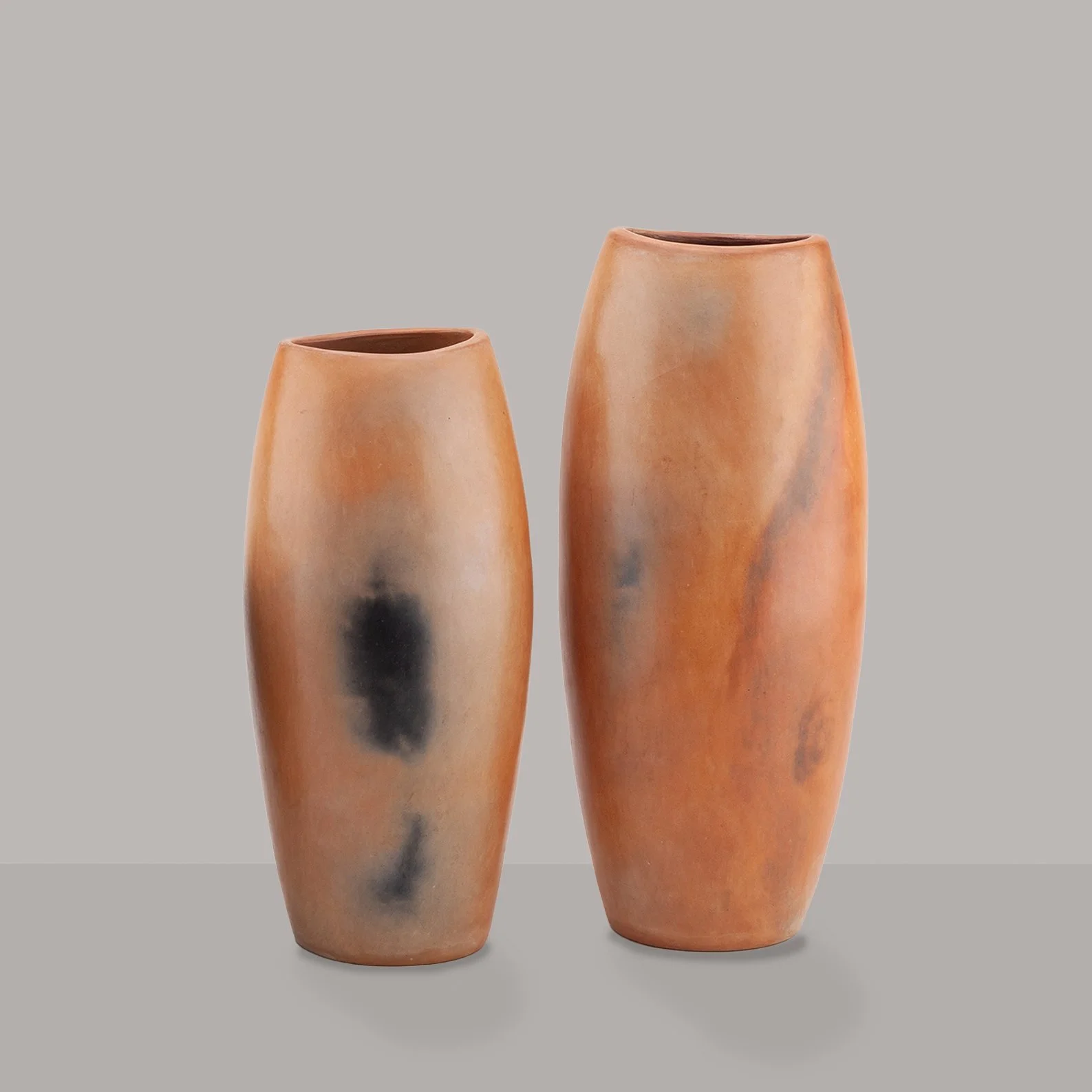 A pair of burnished earthenware decorative vessels
