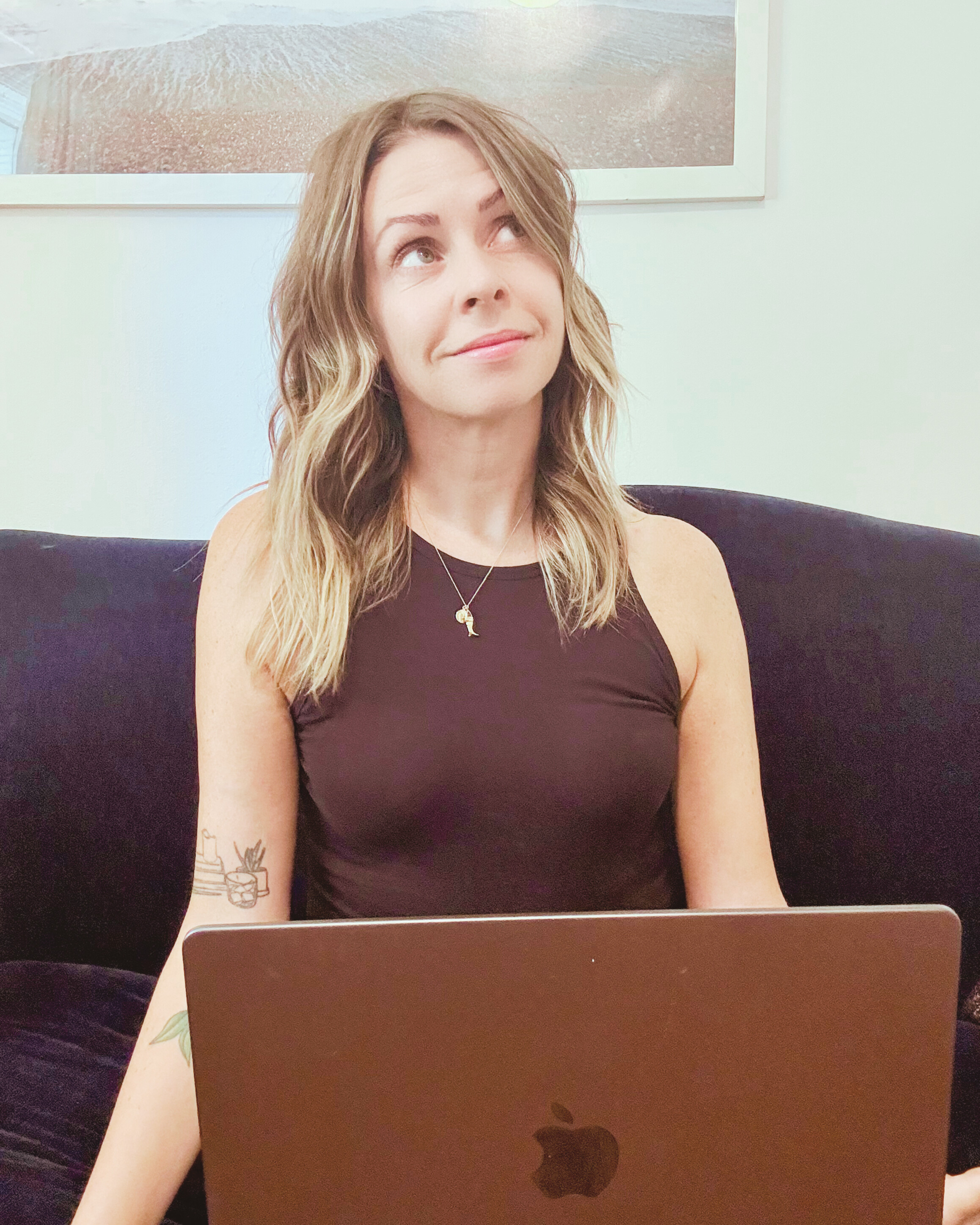 Website designer Rachel Bosworth at home on her laptop thinking about design